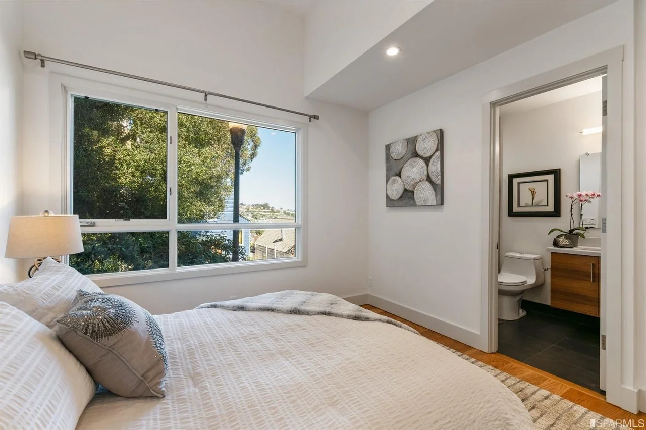 Bedroom in single-family home addition with neutral finishes and recessed lights — San Francisco Bay Area general contractor