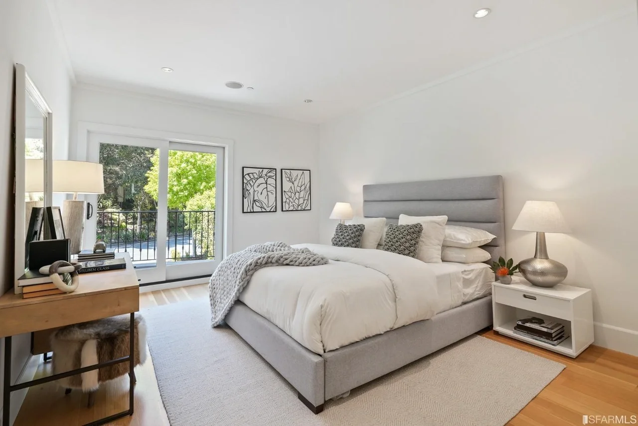 Spacious bedroom renovation with large windows and updated flooring — San Francisco Bay Area general contractor.
