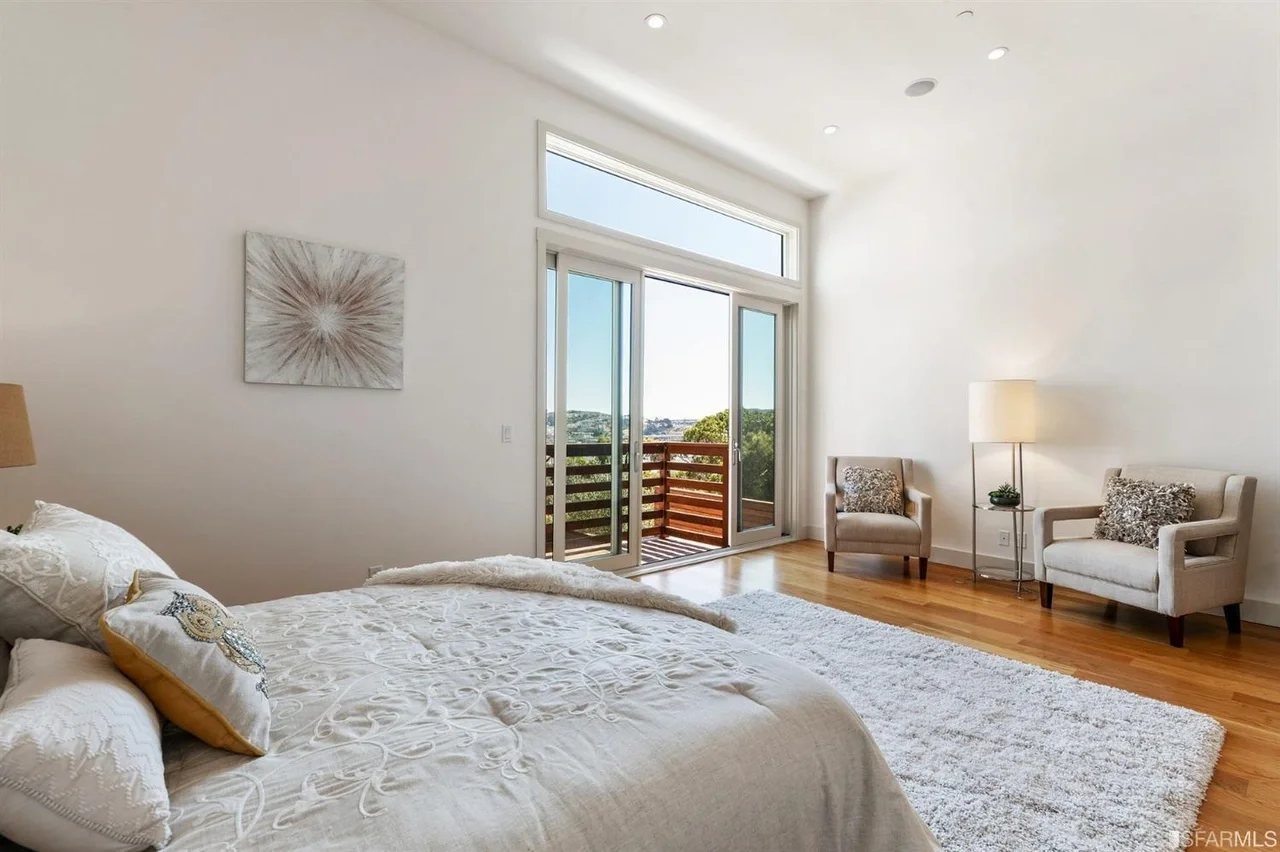 Primary bedroom in home addition with large windows and city view — San Francisco Bay Area general contractor