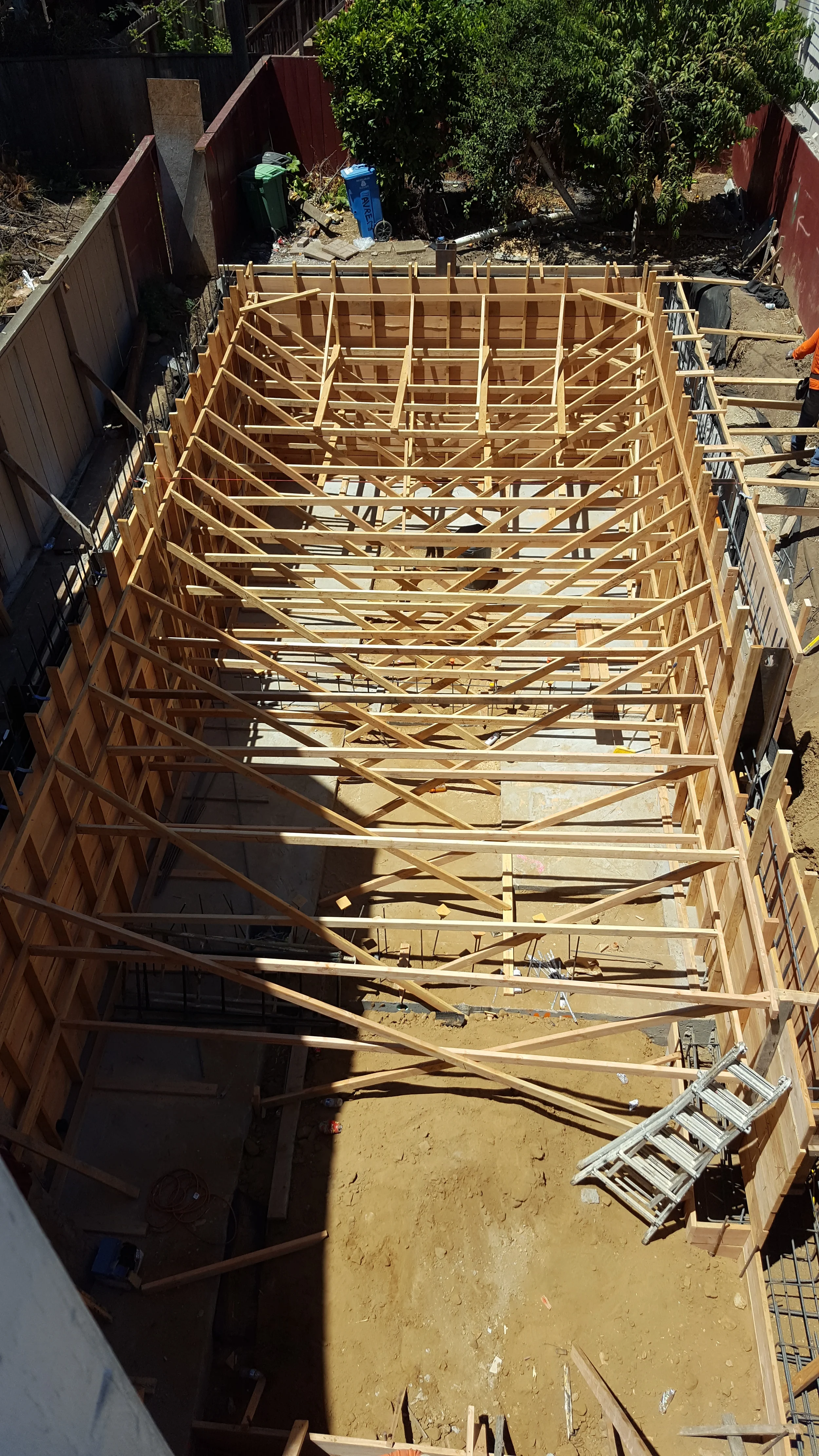 Rebar grid set for concrete foundation work in condominium renovation — San Francisco Bay Area general contractor