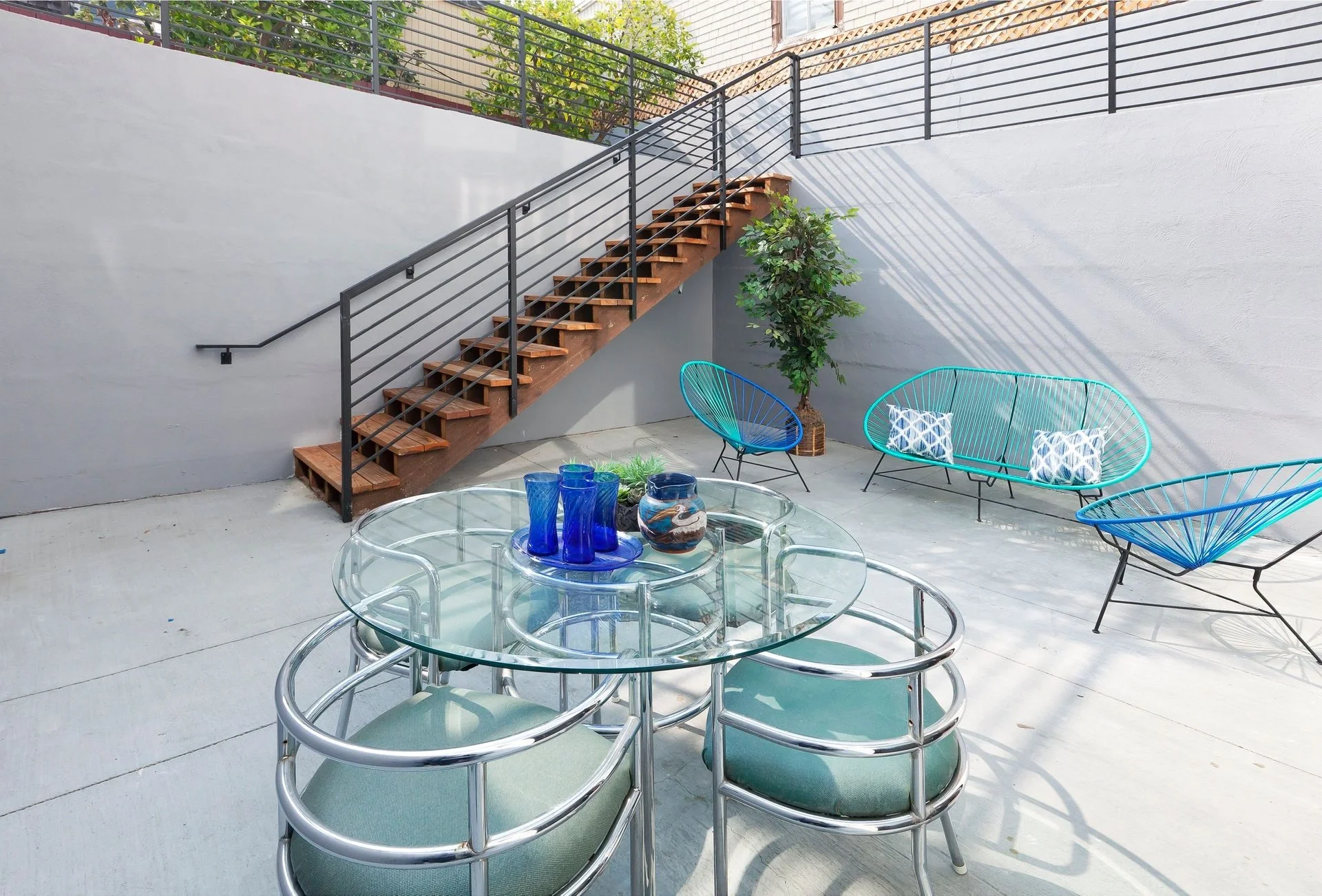 Outdoor patio seating area near stairs in condo renovation — San Francisco Bay Area general contractor