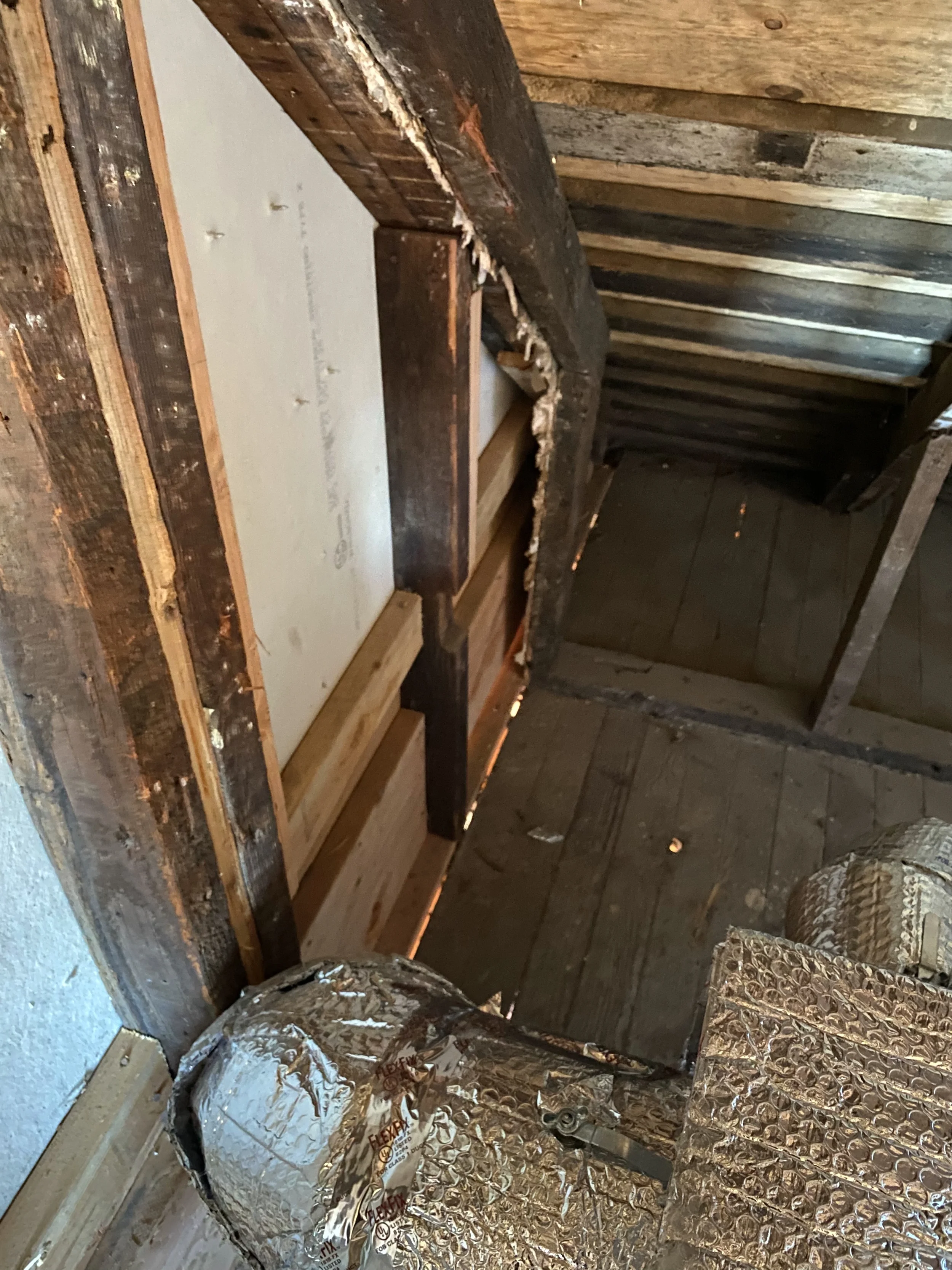 Two-story detached ADU crawlspace work area with gravel base and framing — San Francisco Bay Area general contractor