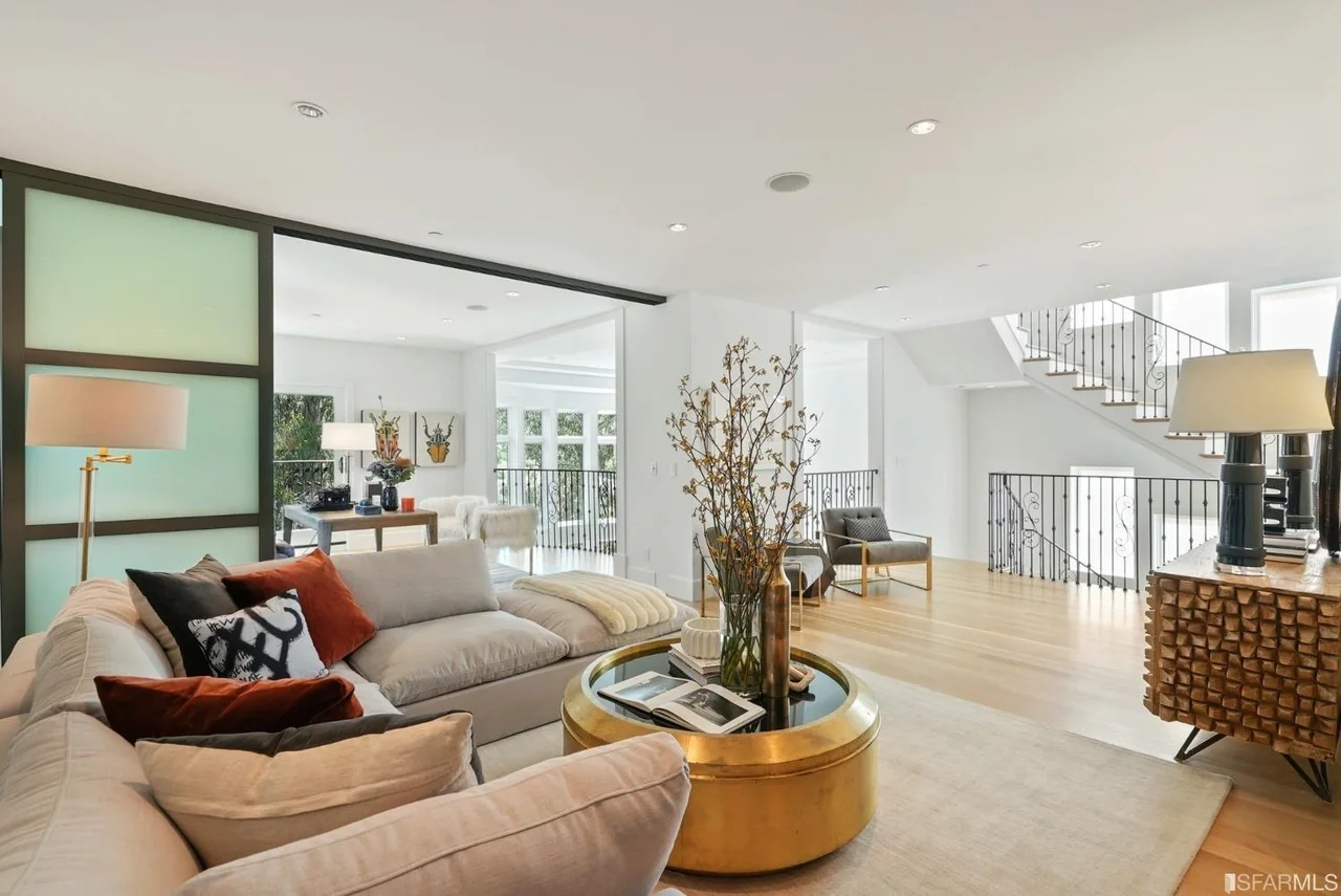 Open-concept living room renovation with hardwood floors and recessed lighting — San Francisco Bay Area general contractor.