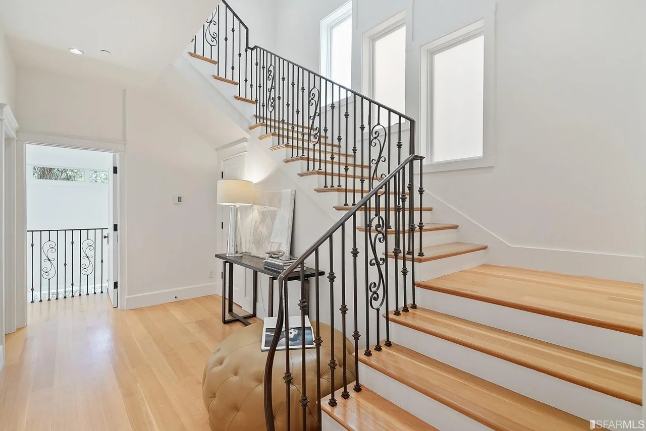 Interior door installation with custom wood-finished storage area — San Francisco Bay Area general contractor.