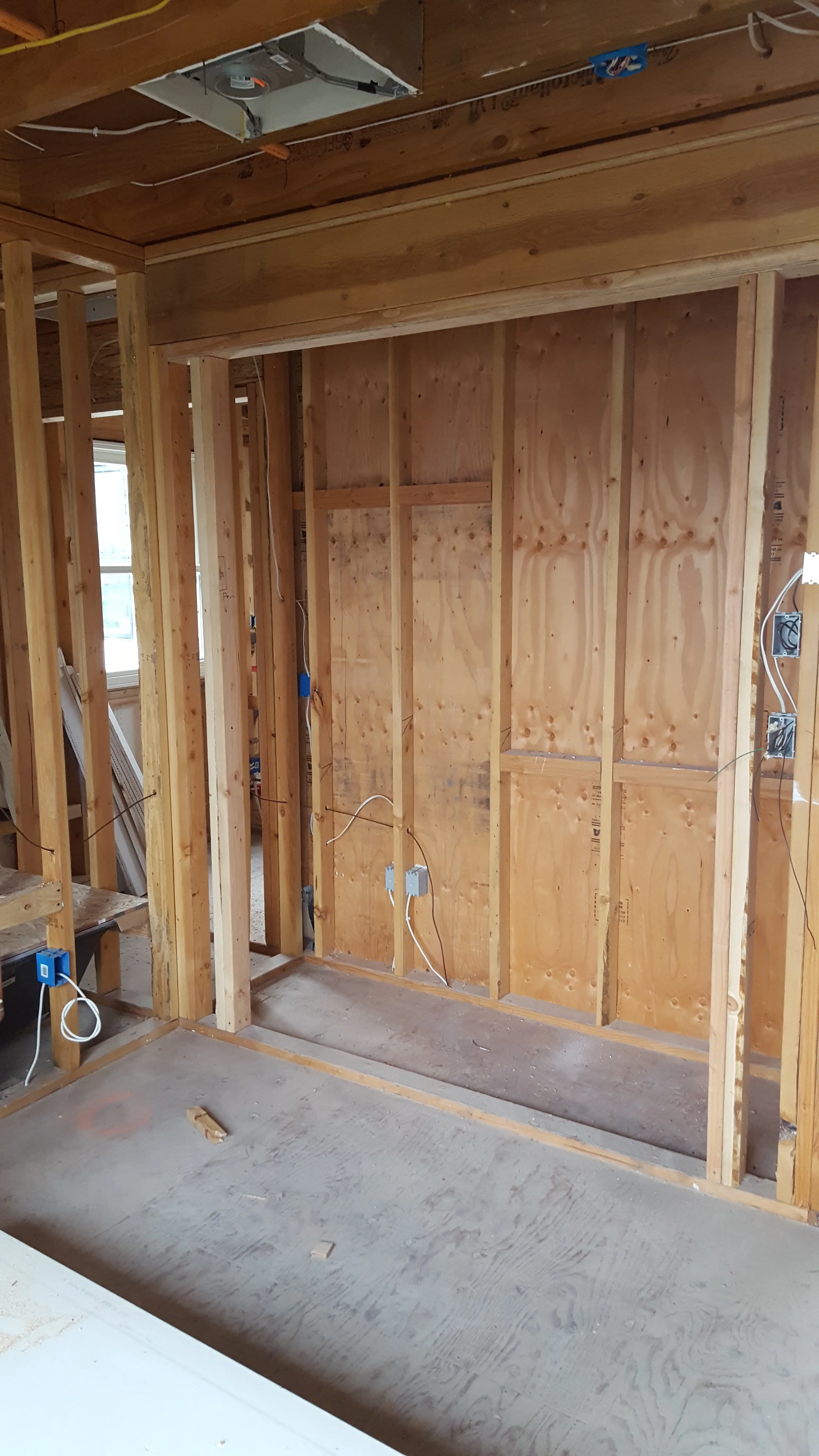 Condo remodel in progress with framed walls and exposed studs — San Francisco Bay Area general contractor