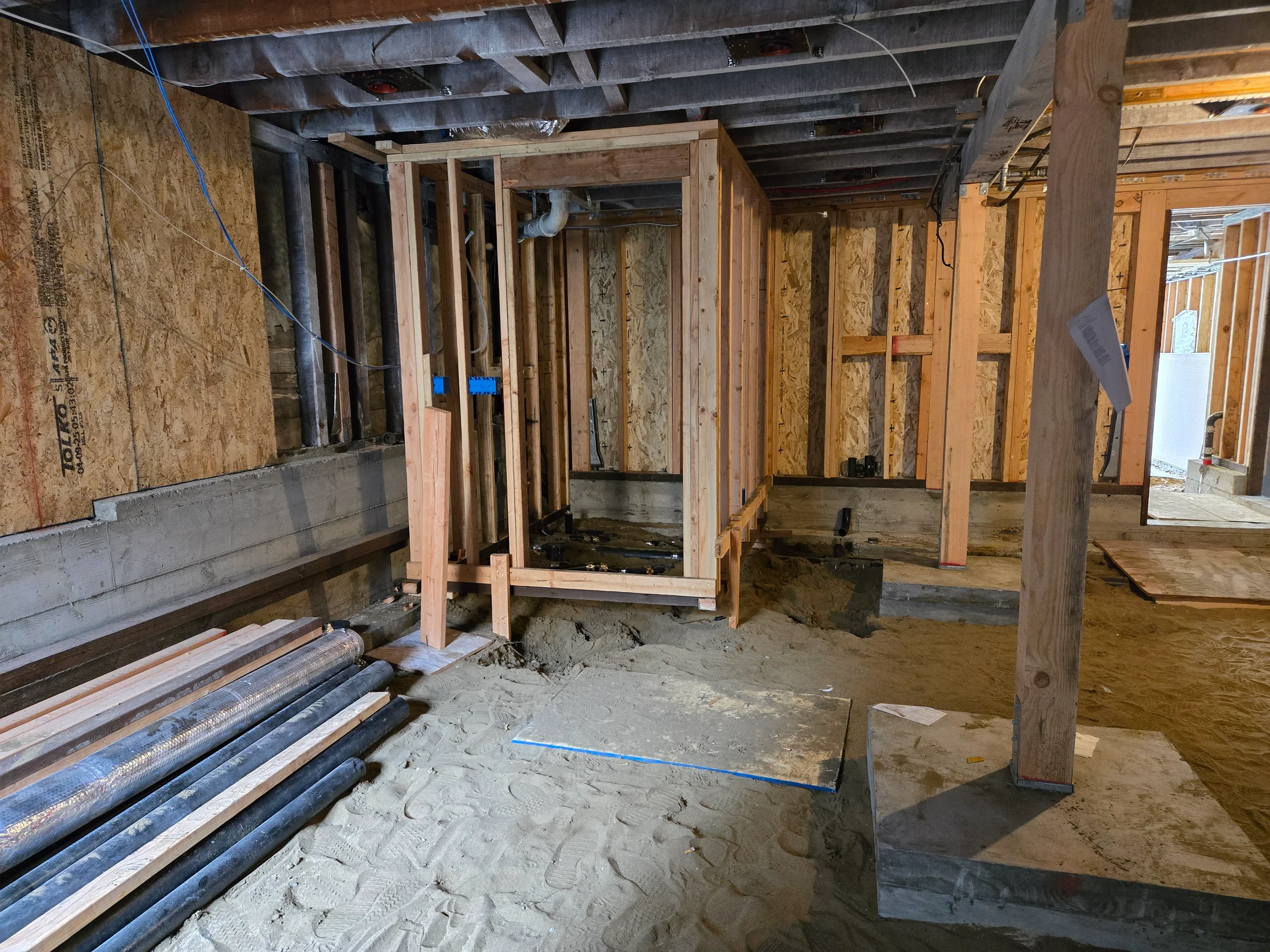 Framed opening and blocking in crawlspace for ground-floor conversion layout — San Francisco Bay Area general contractor
