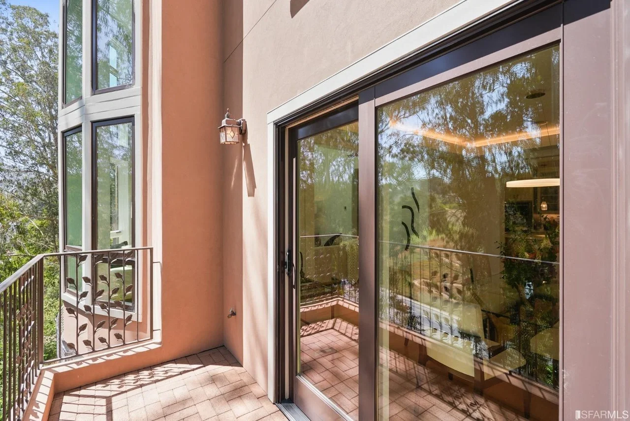 Indoor-outdoor connection with updated door opening to a private deck and exterior landing — San Francisco Bay Area general contractor.