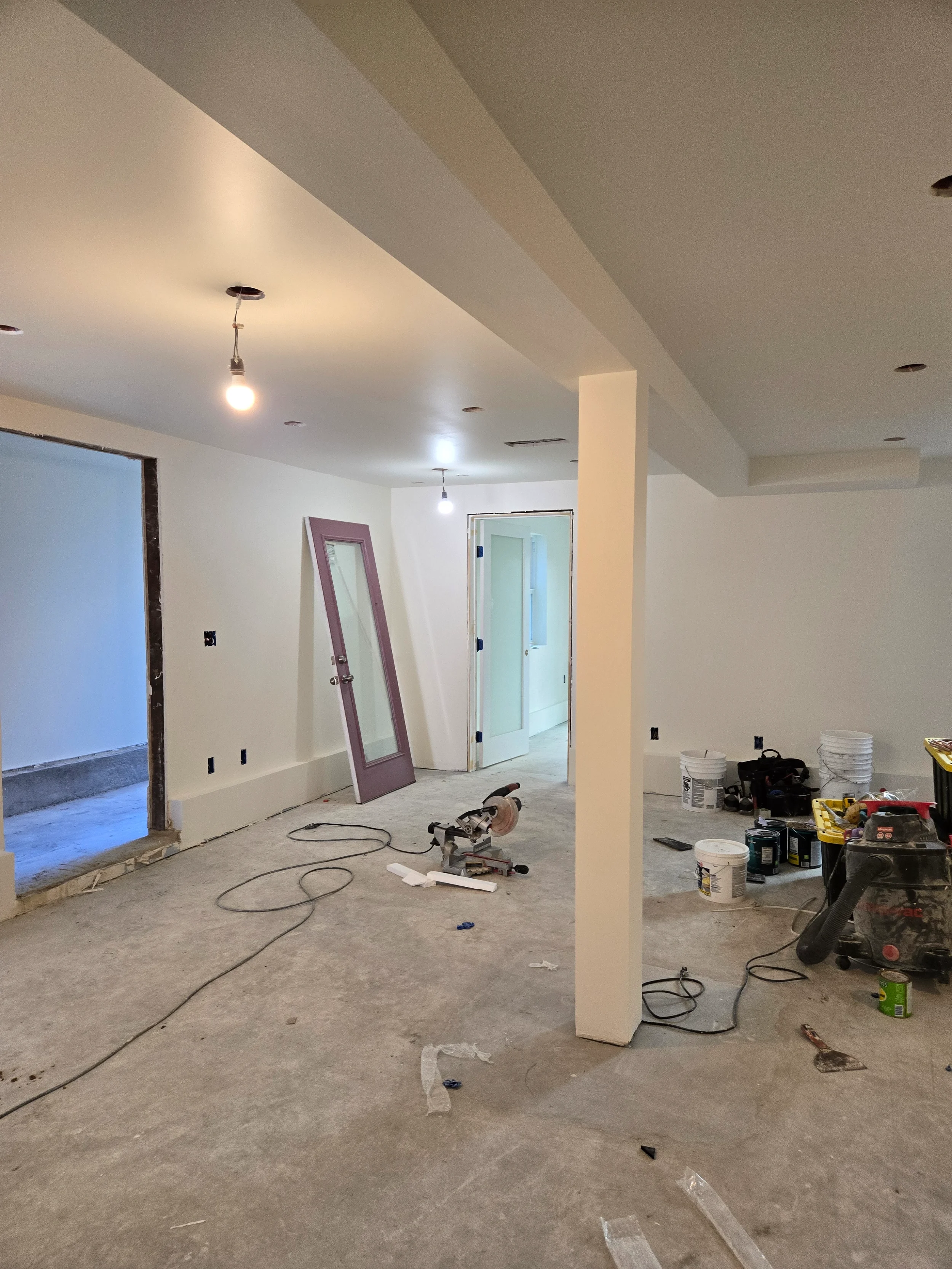 Ground-floor build-out in progress with framing, rough-in areas, and construction staging — San Francisco Bay Area general contractor