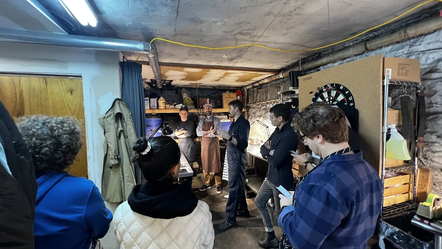 Students at the bench during a sharpening class in Astoria