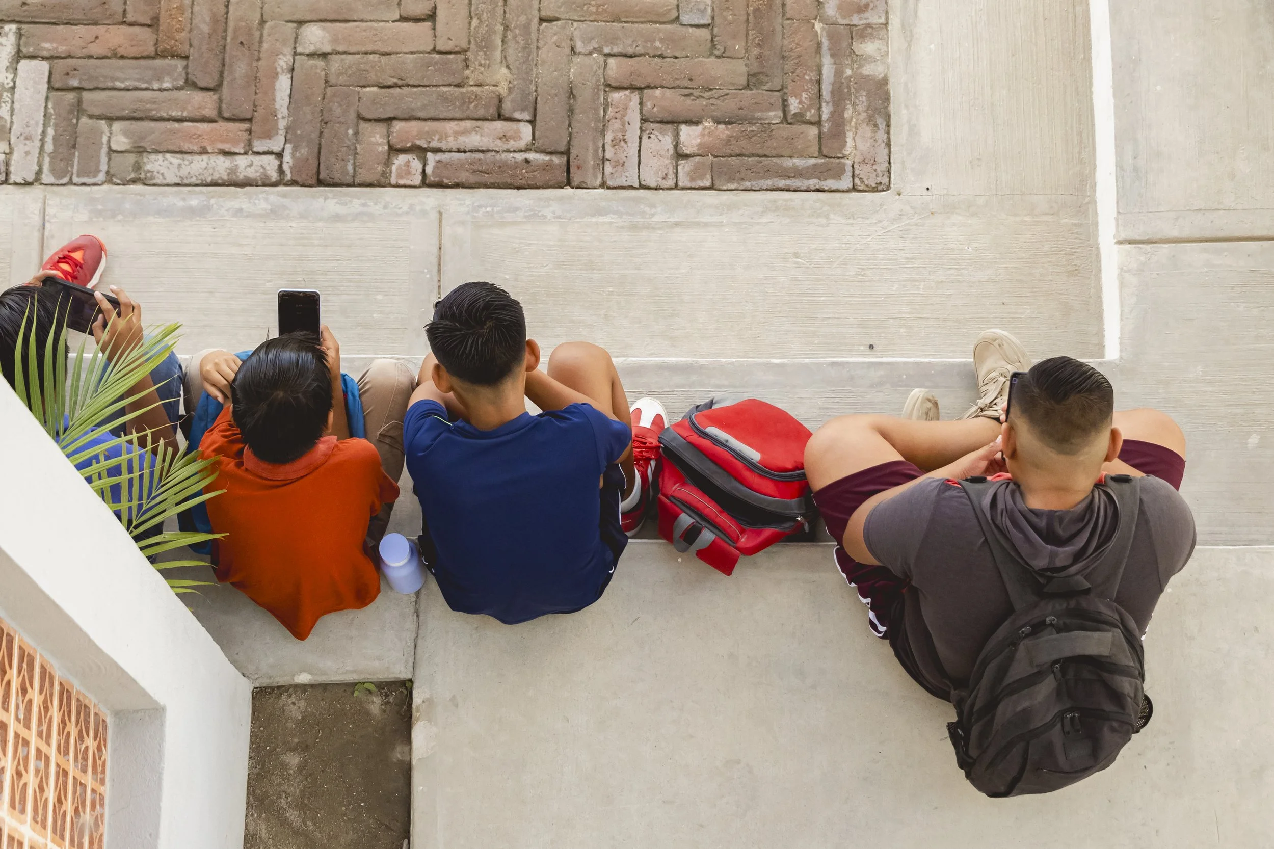 Courtyard seen from the second floor. Students during the break of Spanish & Math tutoring class.