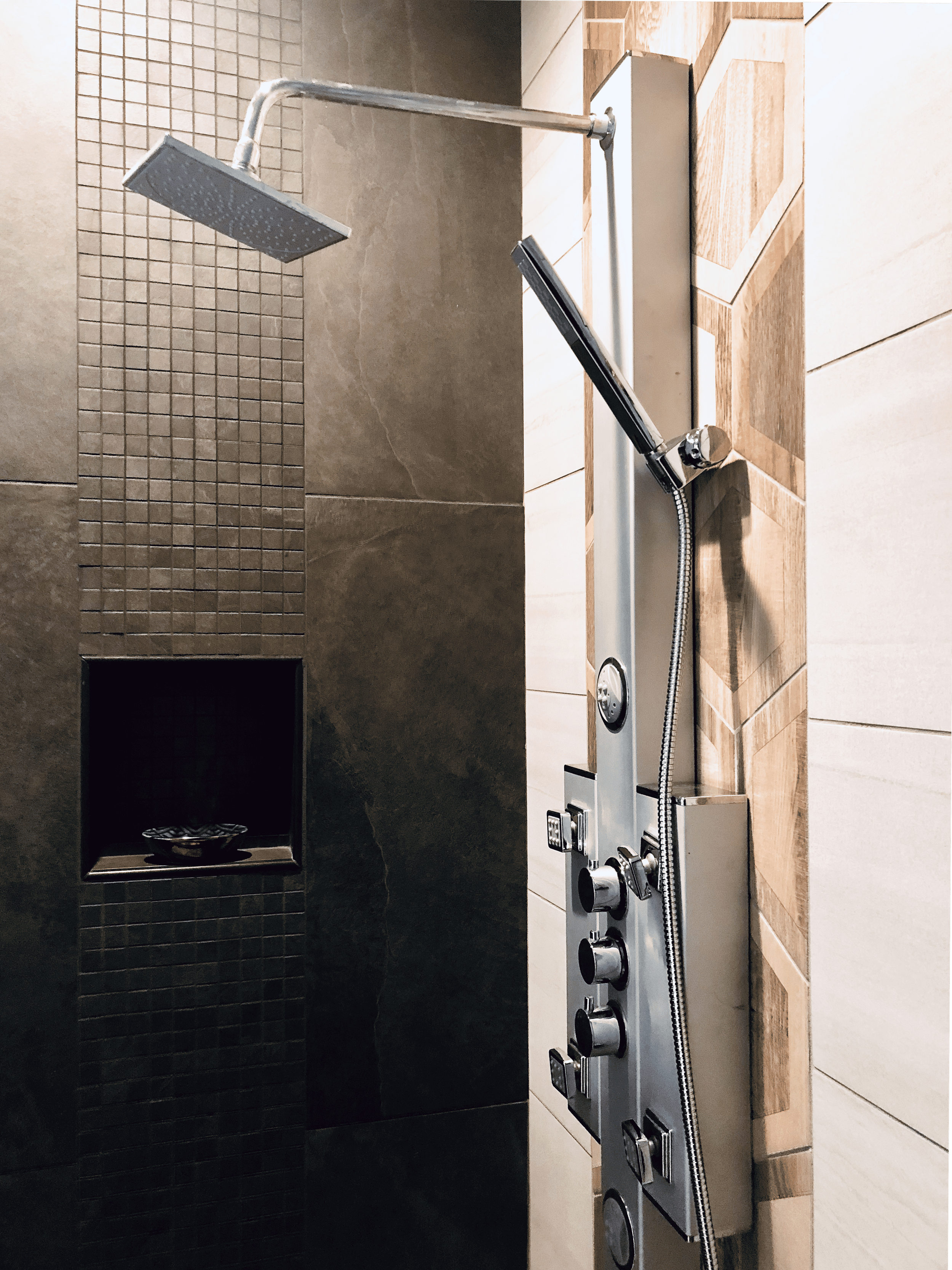 Buckhead luxury multi-function shower panel with rain head and dark mosaic tile wall alongside hexagon wood-look accent tile, designed by Luxe Style Studio