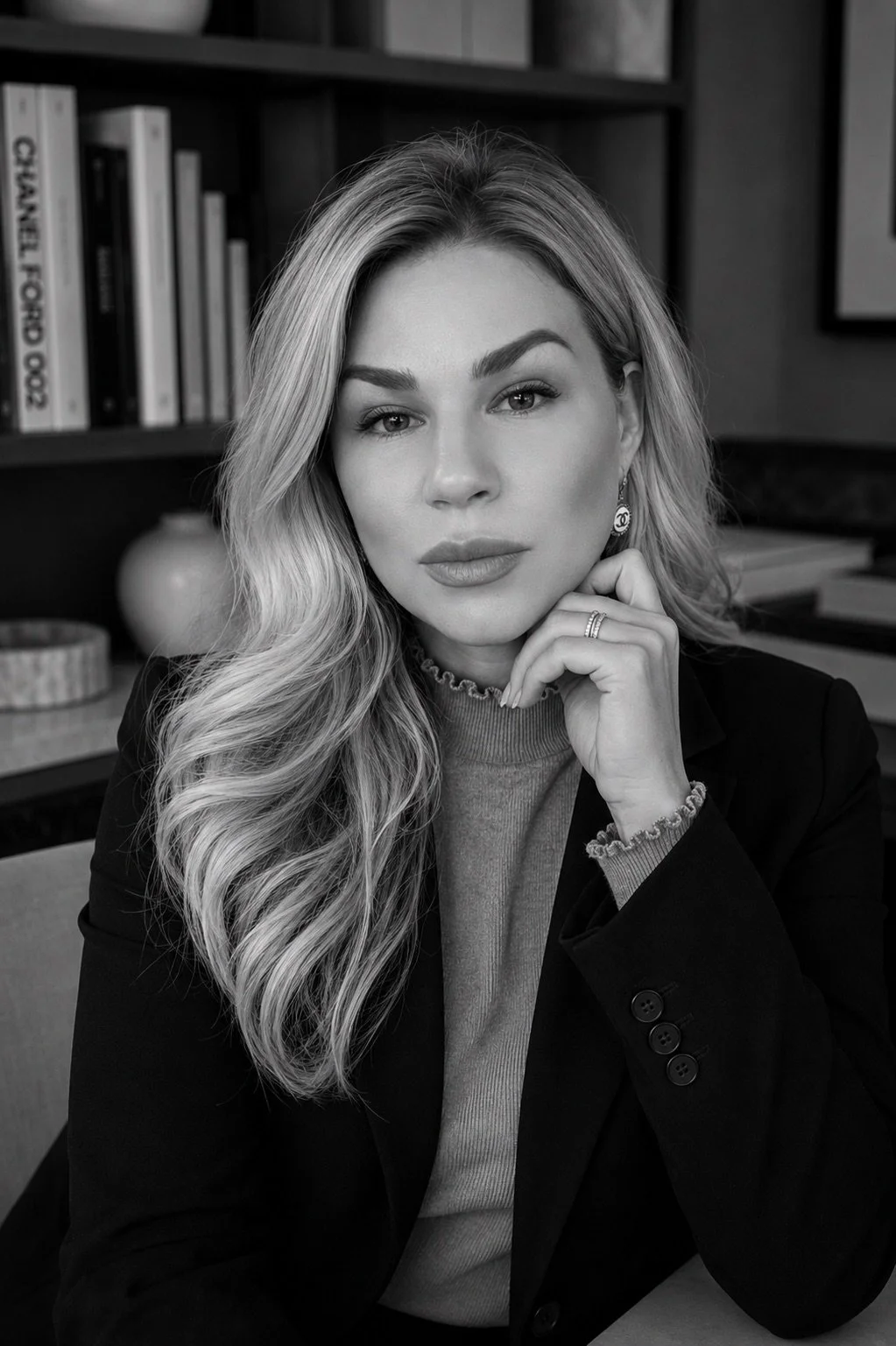Ashley Schneider, founder and principal designer of Luxe Style Studio, in a black-and-white editorial portrait.