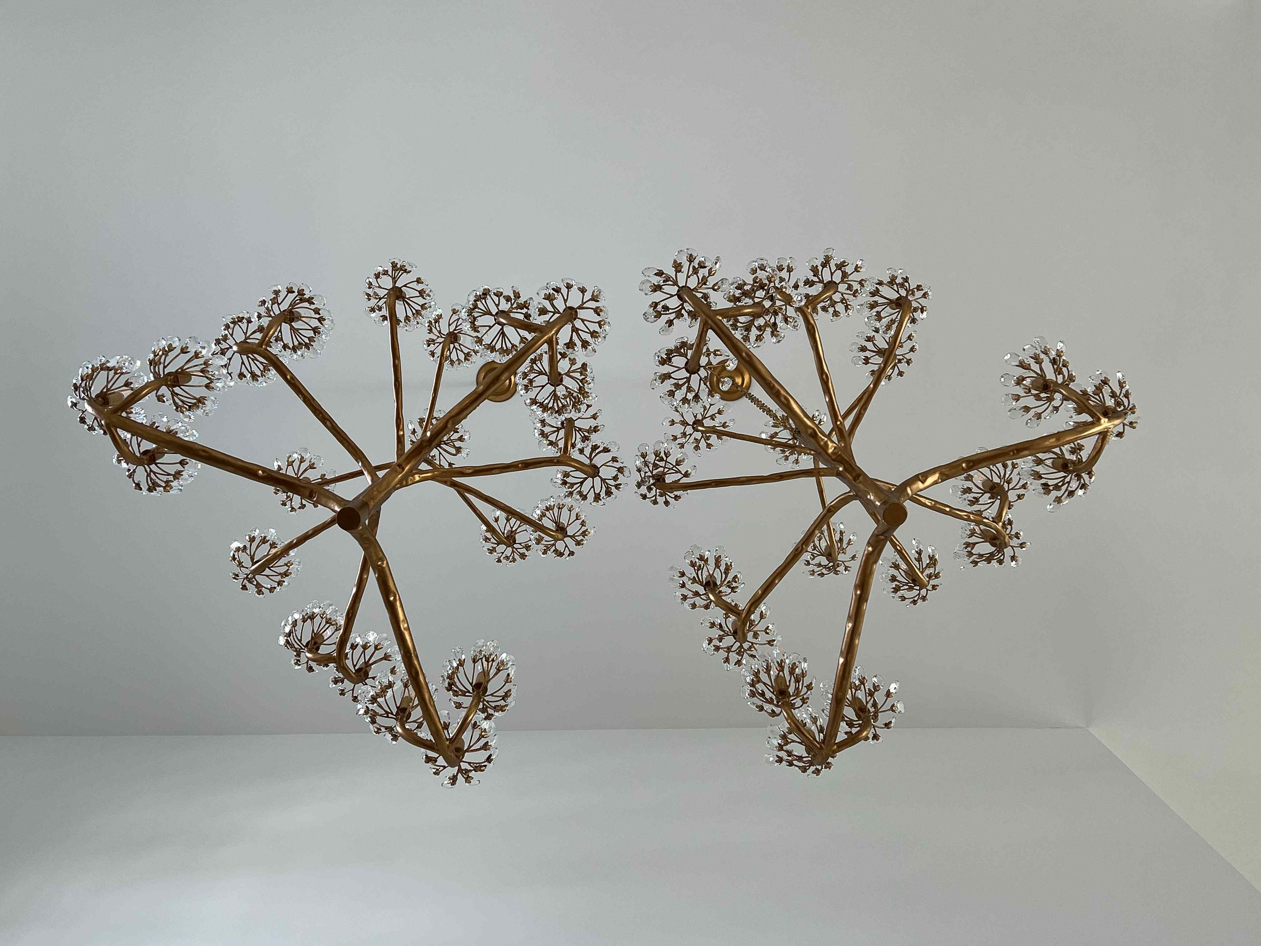 Pair of sculptural brass branching hanging chandeliers with crystal blossom accents, sourced by Luxe Style Studio