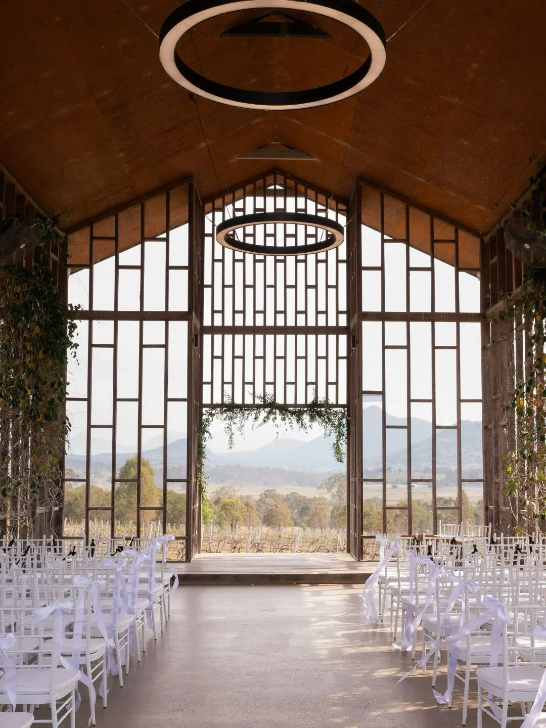 What a beautiful backdrop for Brittany + Brady&rsquo;s ceremony at Kooroomba Lavender Farm 🤍⁠
⁠
Venue @kooroomba_weddings ⁠
Celebrant @marrymeamanda⁠
Florist @demavi_weddings ⁠
Content creator @lovethat.content ⁠
Dress @madewithlovebridal ⁠
Bridesma