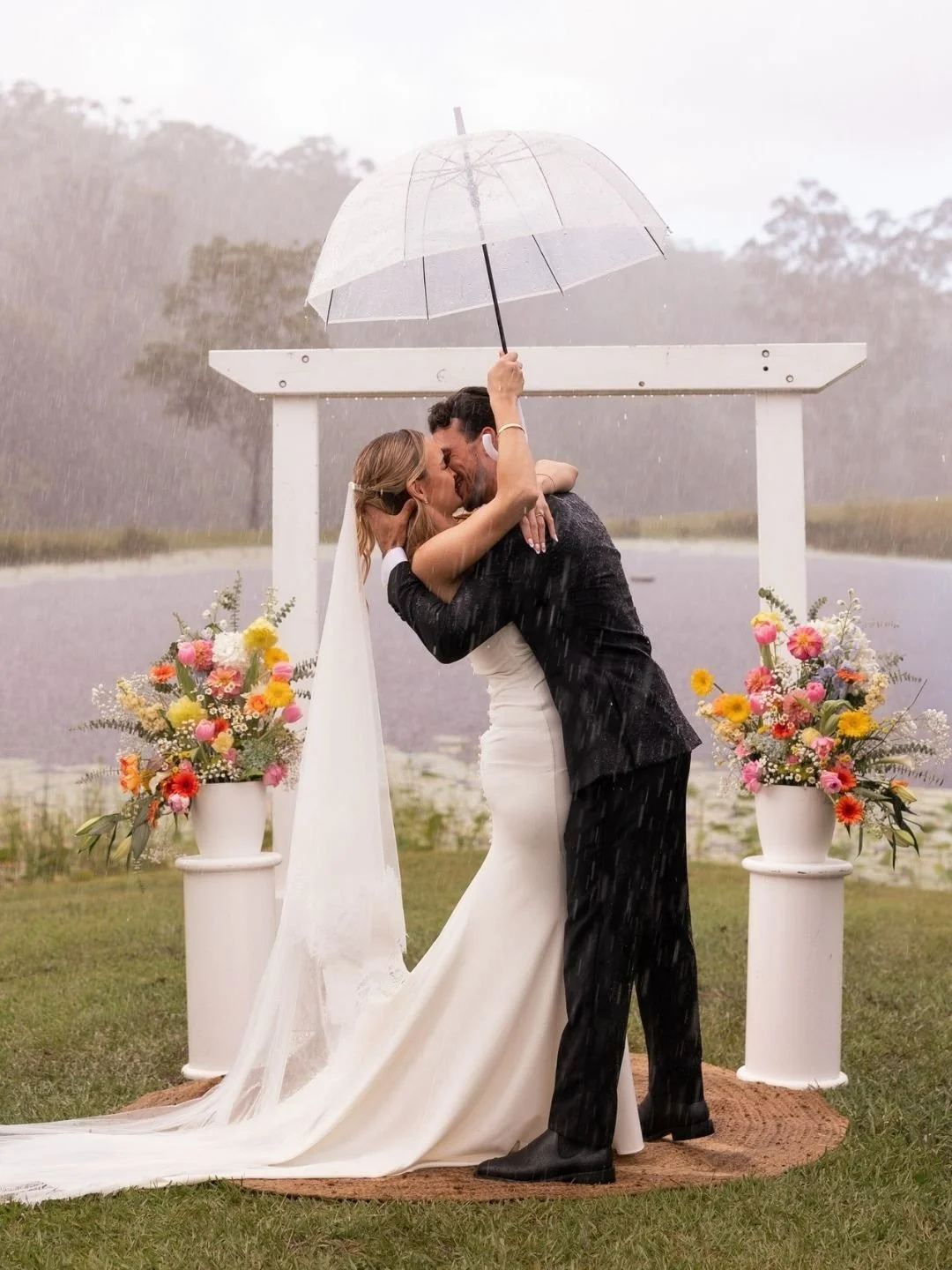 I do, rain or shine. Dreamy moments from Claudia + Robin&rsquo;s wedding day.⁠
⁠
Photographer &amp; videographer @figtreepictures⁠
Venue &amp; hire @goldcoastfarmhouse⁠
Celebrant @capellaweddings⁠
Dress @grace_loves_lace⁠
Suit @peterjacksonau⁠
Hair @