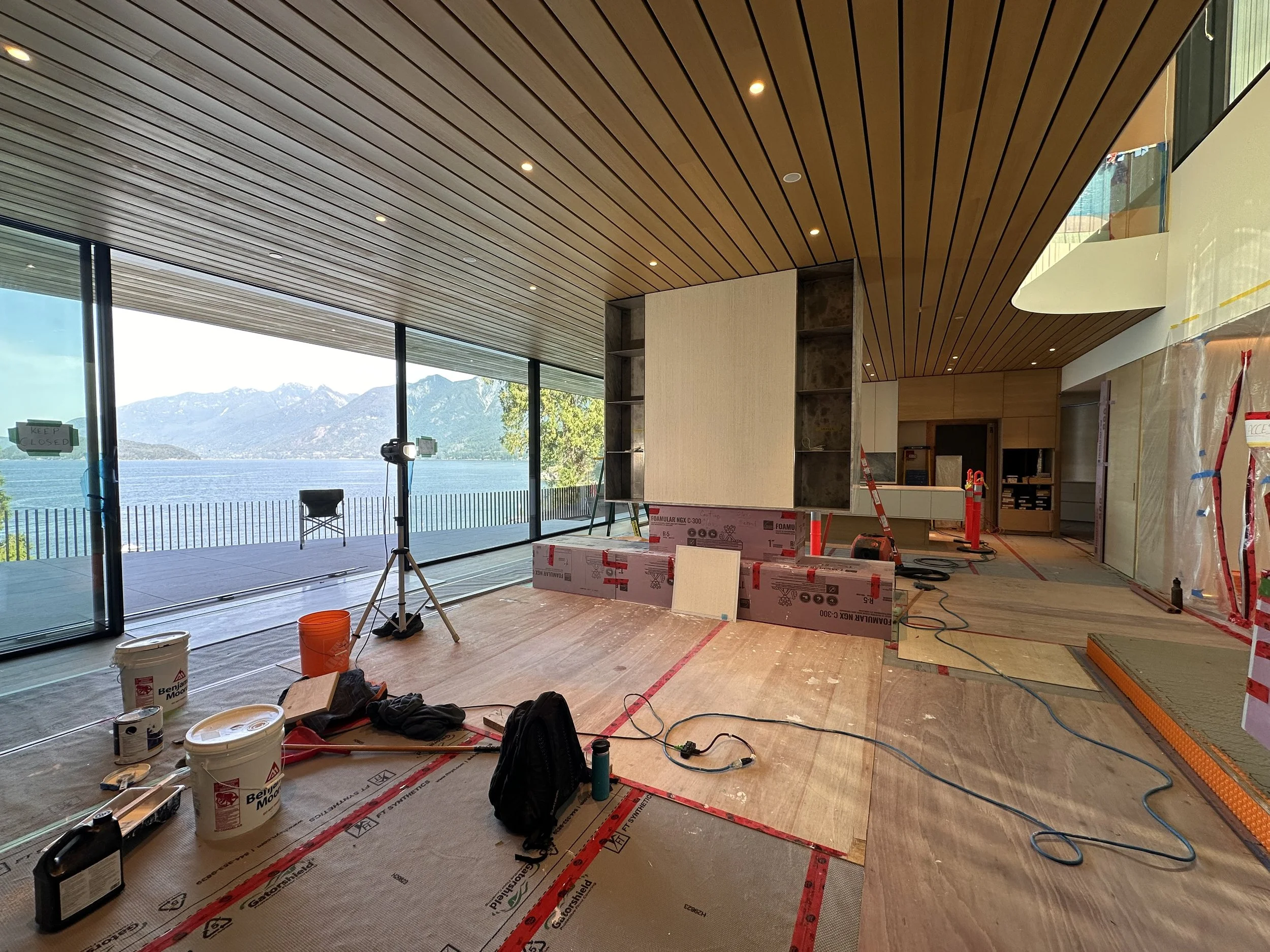 A lime plaster fireplace, finished with a hand-applied drag texture that brings warmth and timeless elegance to the space. Each line is perfectly plumb, with gentle variations creating depth and movement, giving the surface a natural character that i