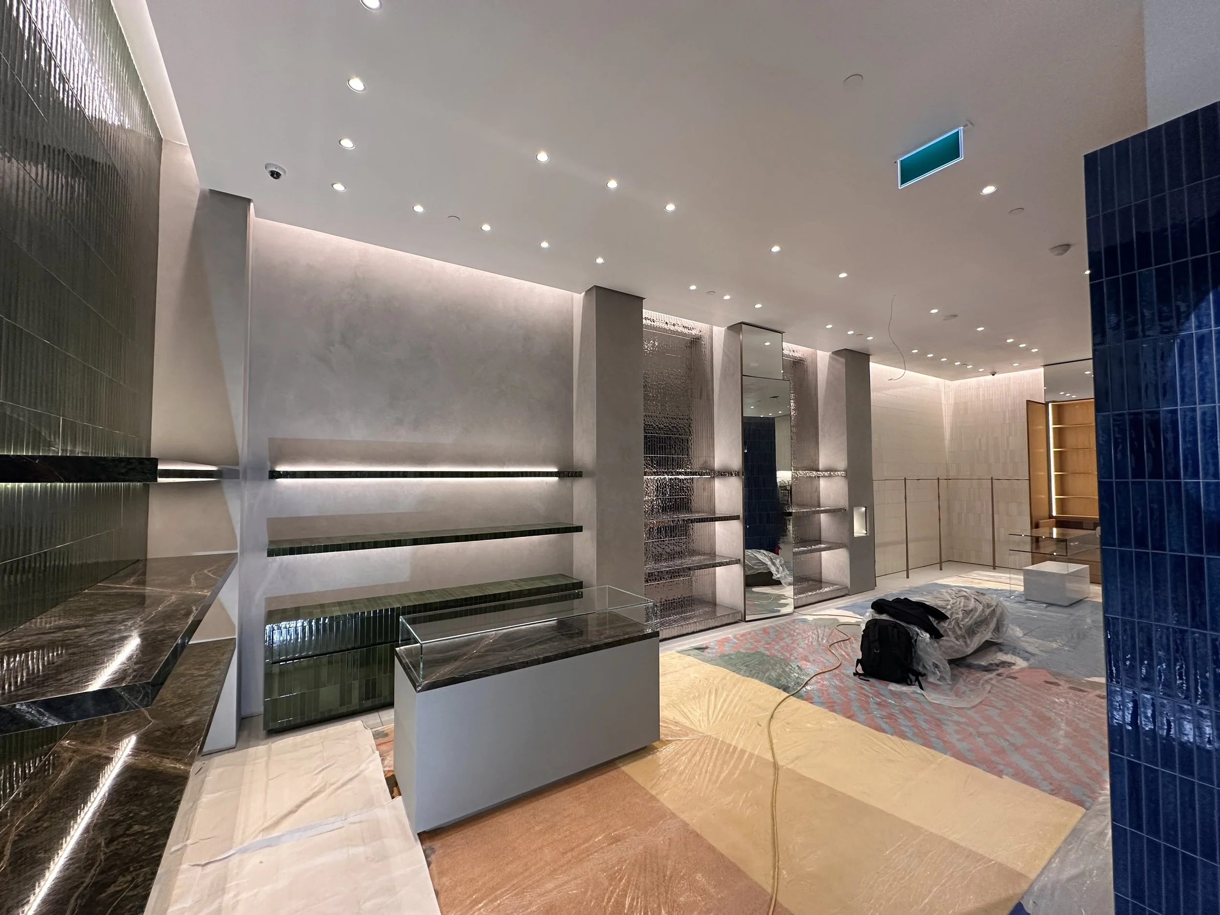 The Loewe store features a refined Marmorino Fine plaster finish, hand-applied to achieve a smooth, elegant surface with graceful depth and movement. This traditional lime-based material enriches the space with a quiet sophistication, balancing moder