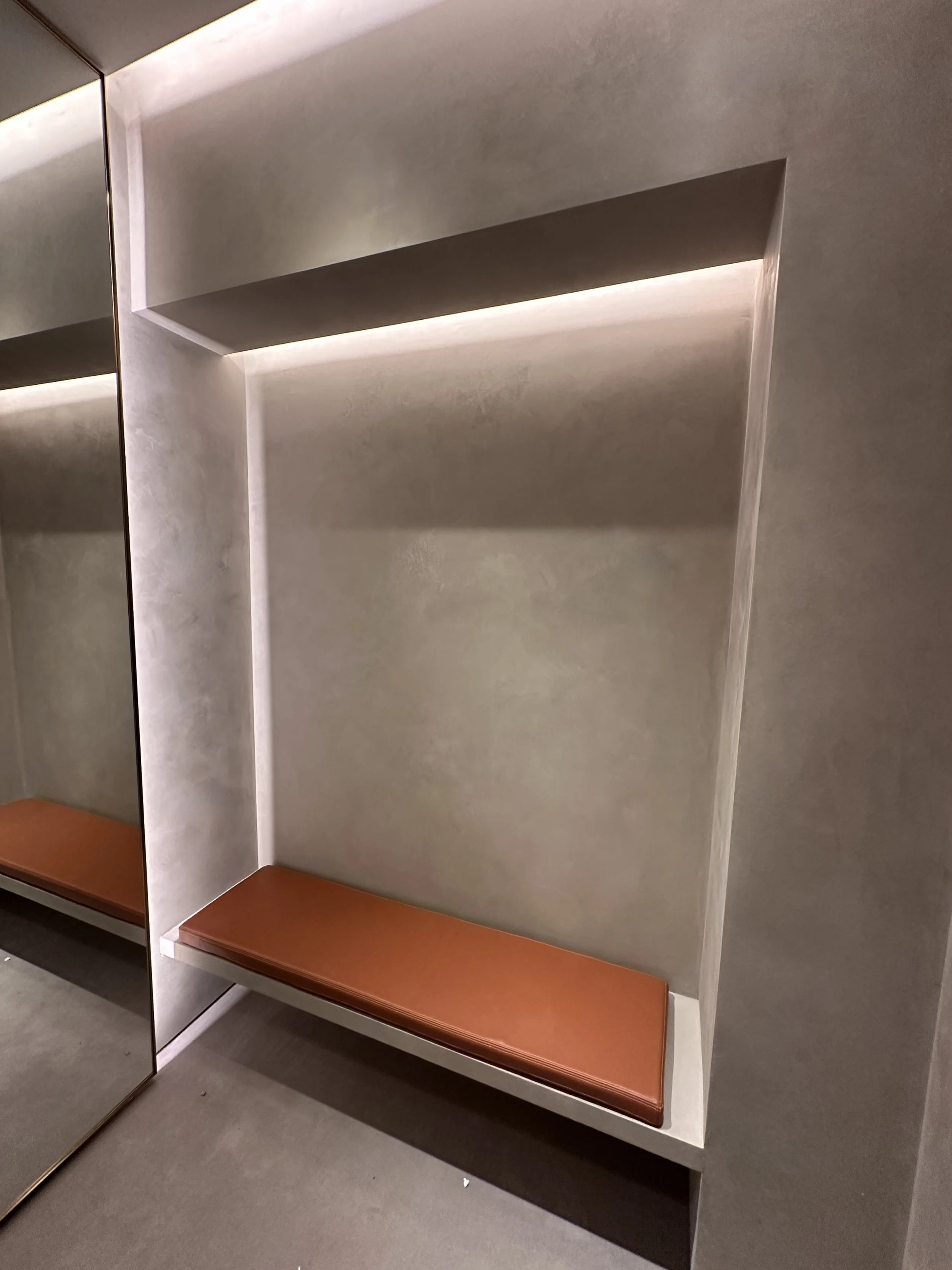 The Loewe fitting rooms were finished in a refined Marmorino Fine plaster, creating a smooth, elegant surface with subtle movement and depth. This traditional lime-based finish enhances the sophisticated aesthetic of the space while maintaining a tim