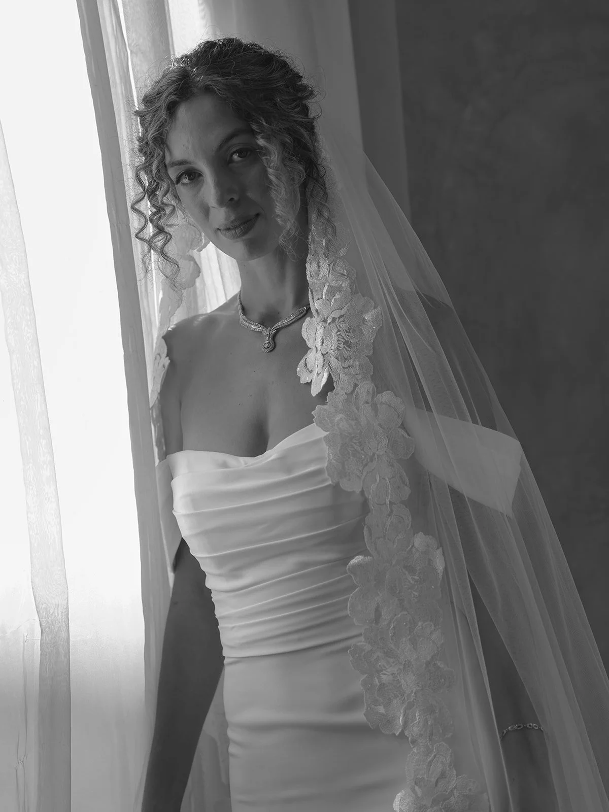 curly hair bride wears hair down for classic and chic malibu wedding day