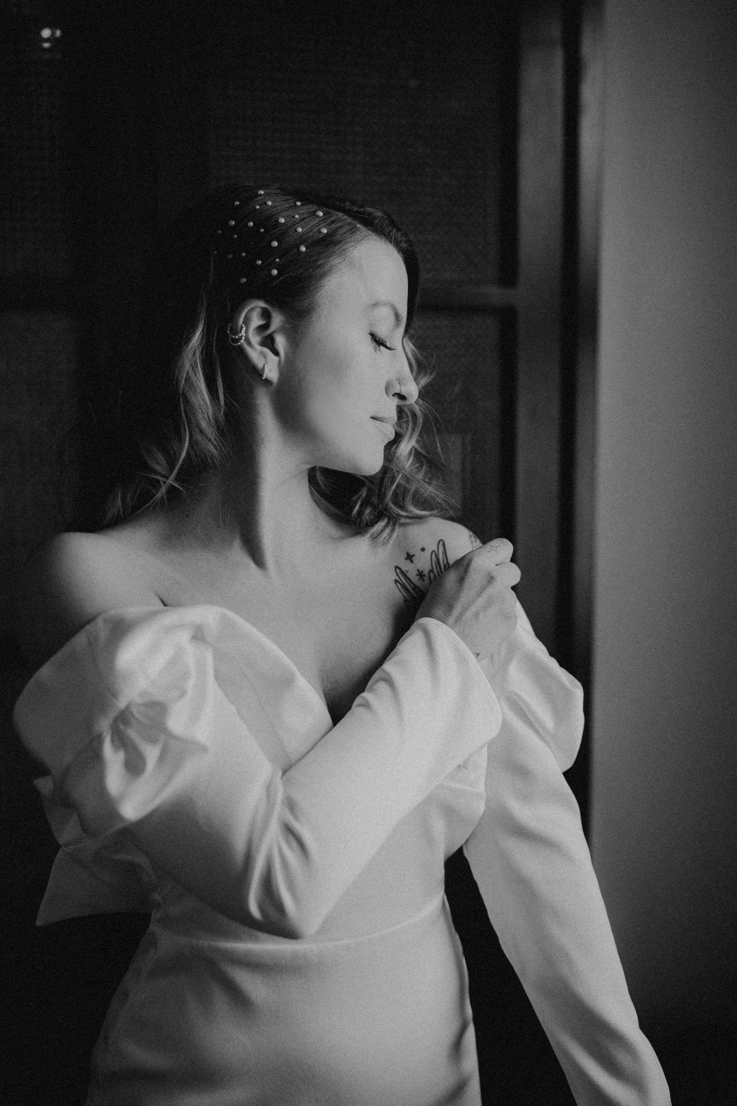 bride gets into her modern and chic wedding gown before her dream dtla wedding