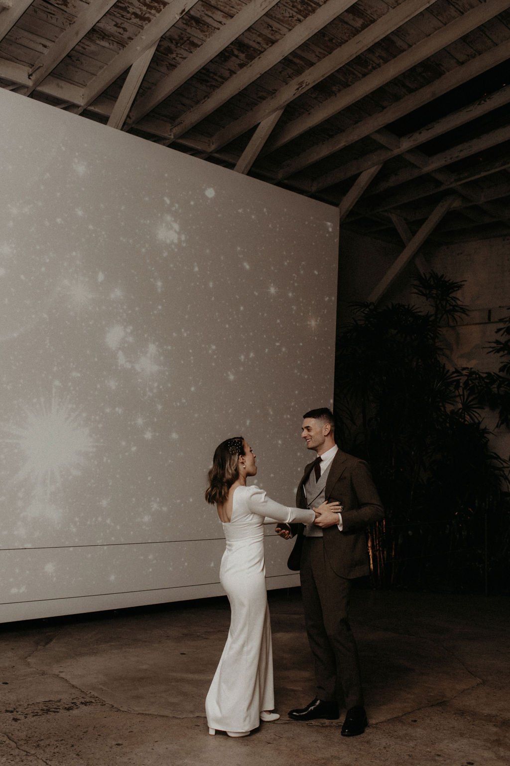 bride and groom share their first dance under the disco ball at millwick in DTLA