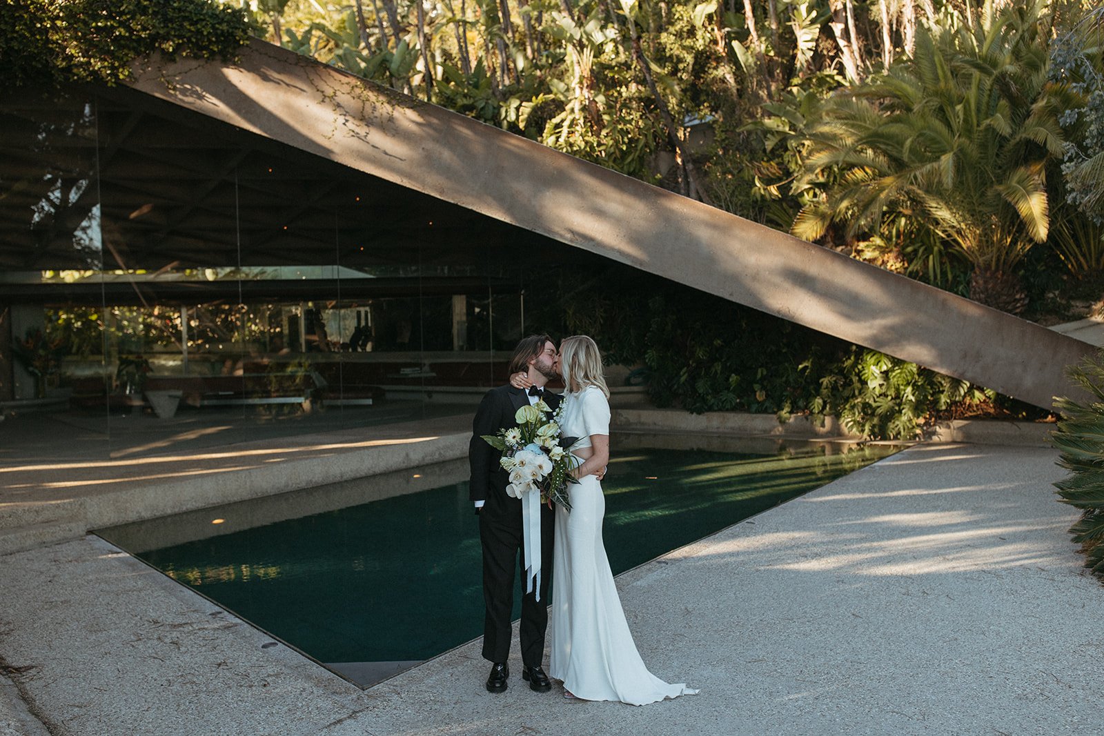 the iconic Sheats–Goldstein Residence was an incredible spot for just-married photos