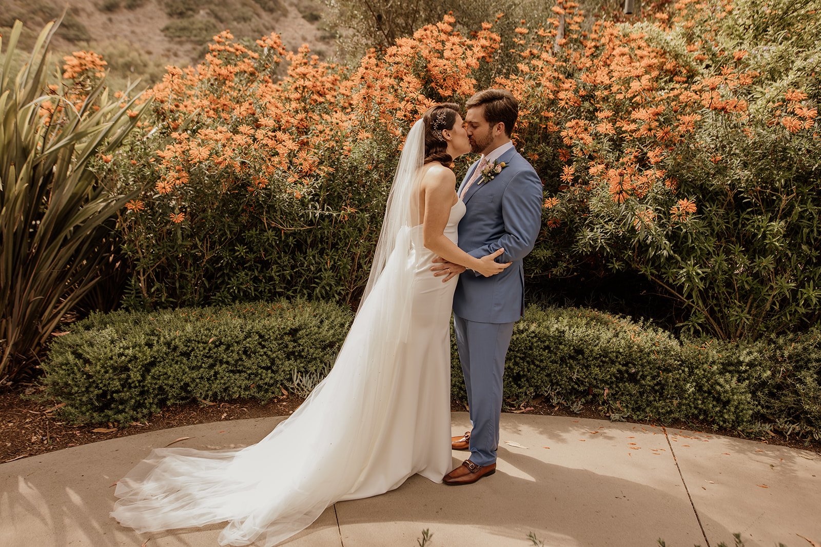 summer wedding in laguna beach presents the most beautiful blooming flowers around the ranch at laguna beach property