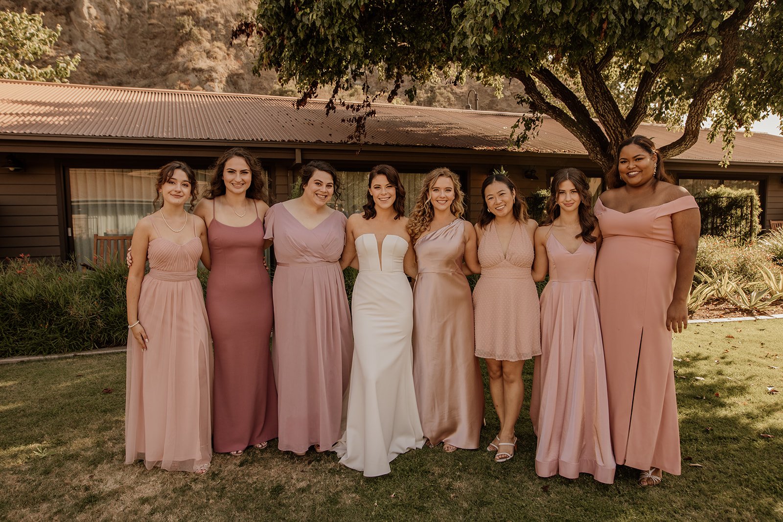 bride and bridesmaids in neutral, soft pink dresses at the ranch at laguna beach