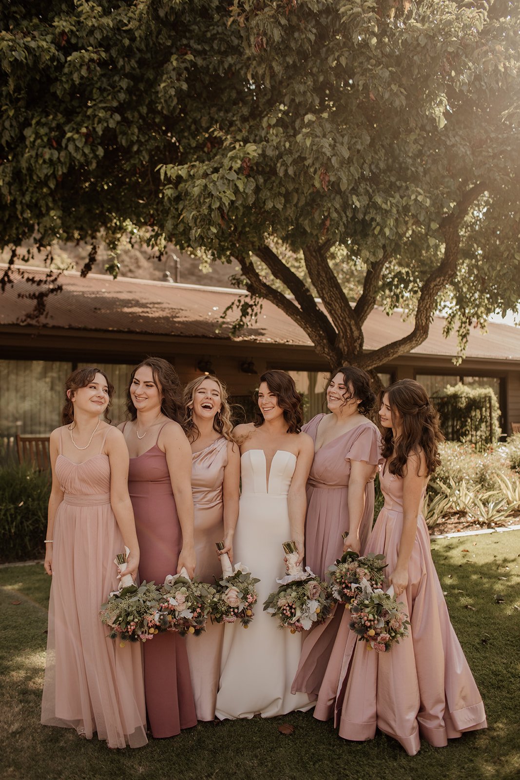 bridal party poses for photos before wedding ceremony at the ranch at laguna beach