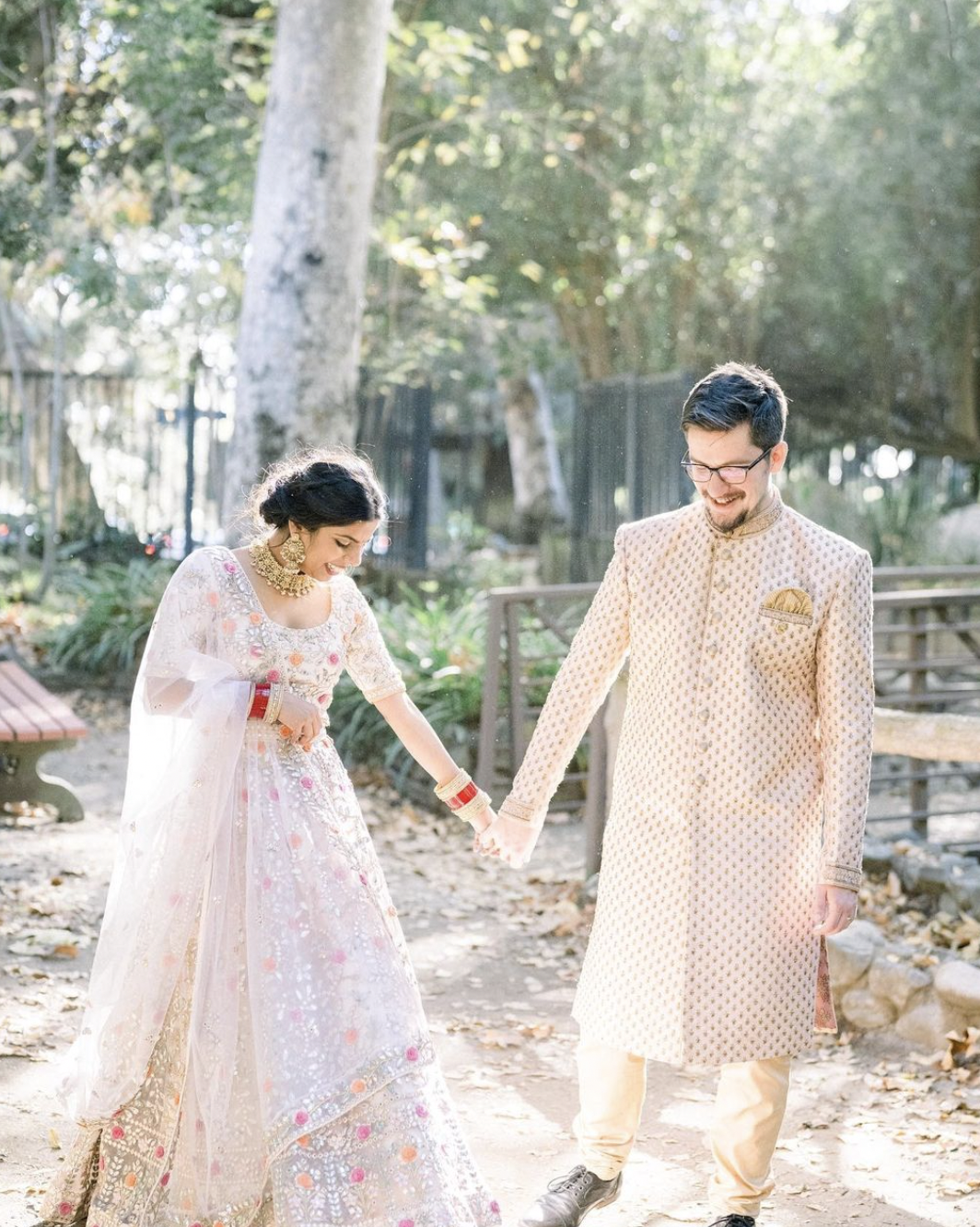 our indian bride chose natural and glowing makeup with a loose, low updo to showcase her gorgeous traditional indian bridal outfit