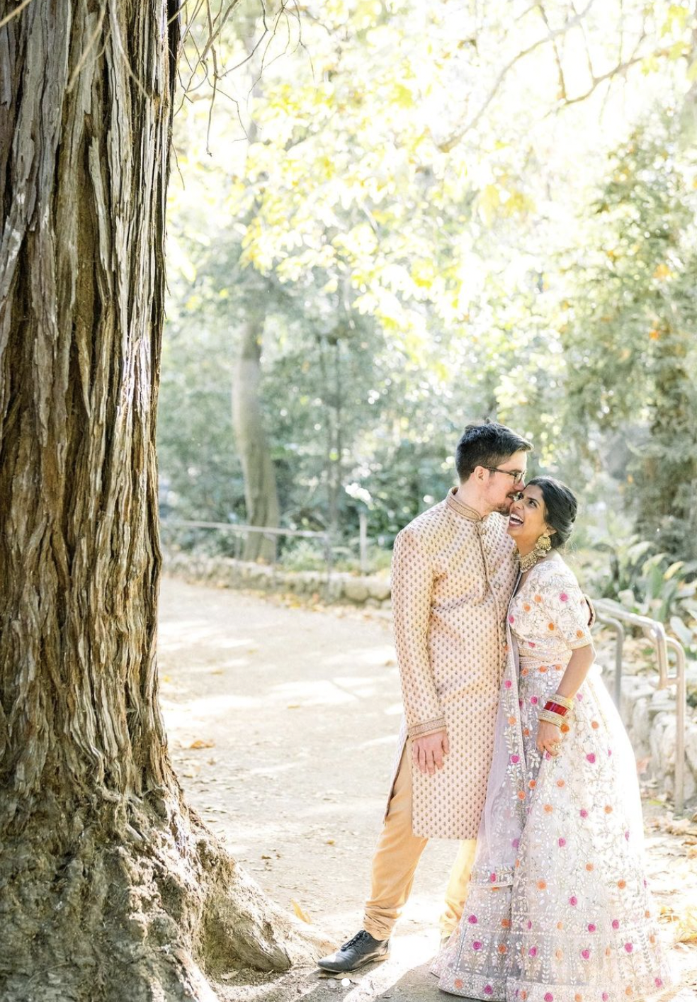 our indian bride chose natural and glowing makeup with a loose, low updo to showcase her gorgeous traditional indian bridal outfit