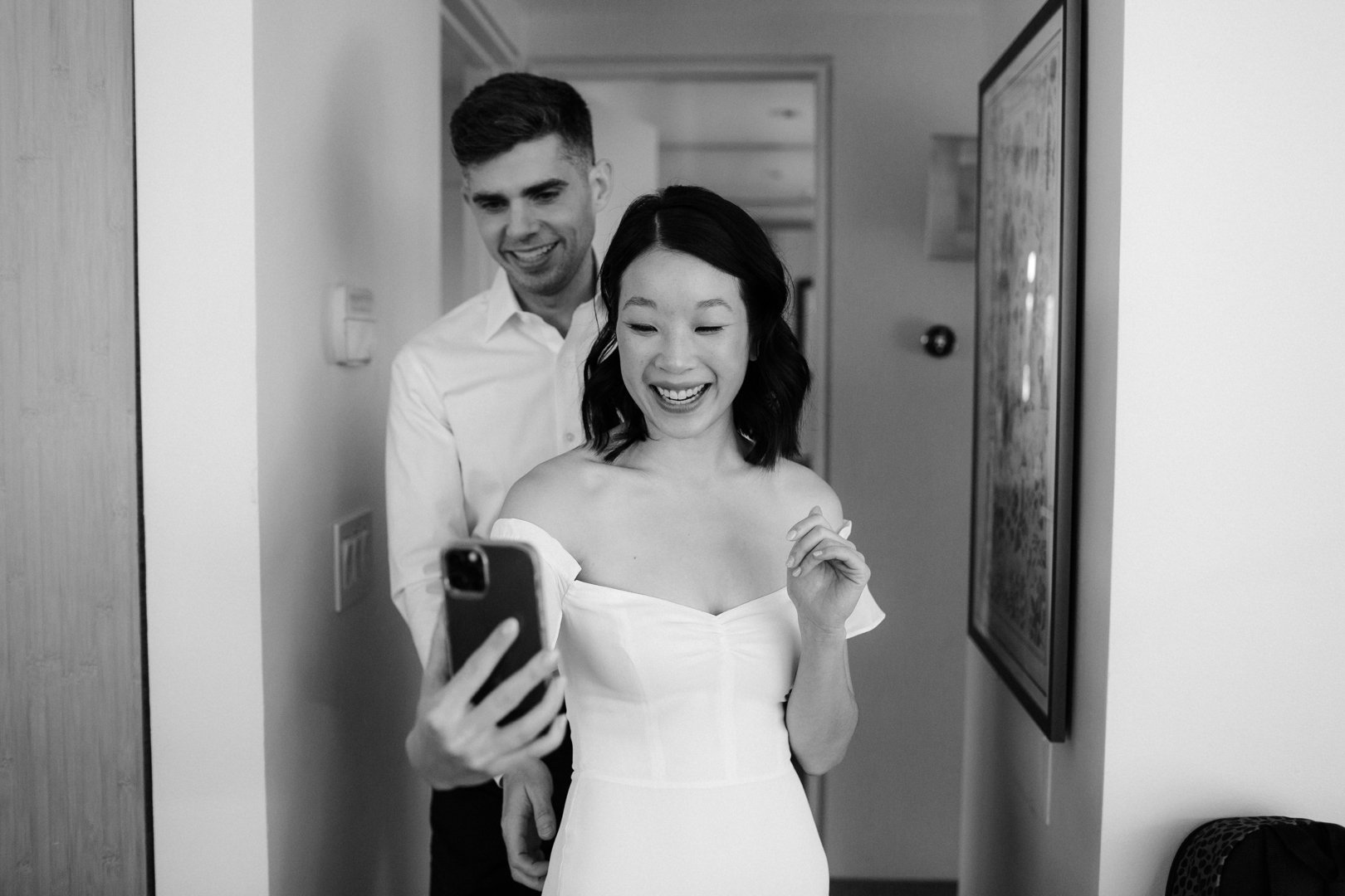 bride and groom facetime with friends and family before their elopement