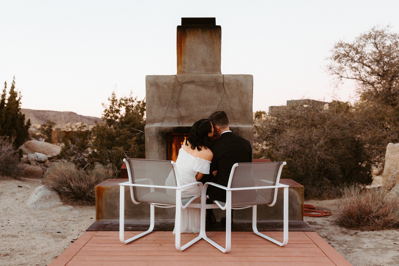 after the intimate wedding ceremony, our couple goes back to their airbnb to sit by the fire and enjoy their view of joshua tree