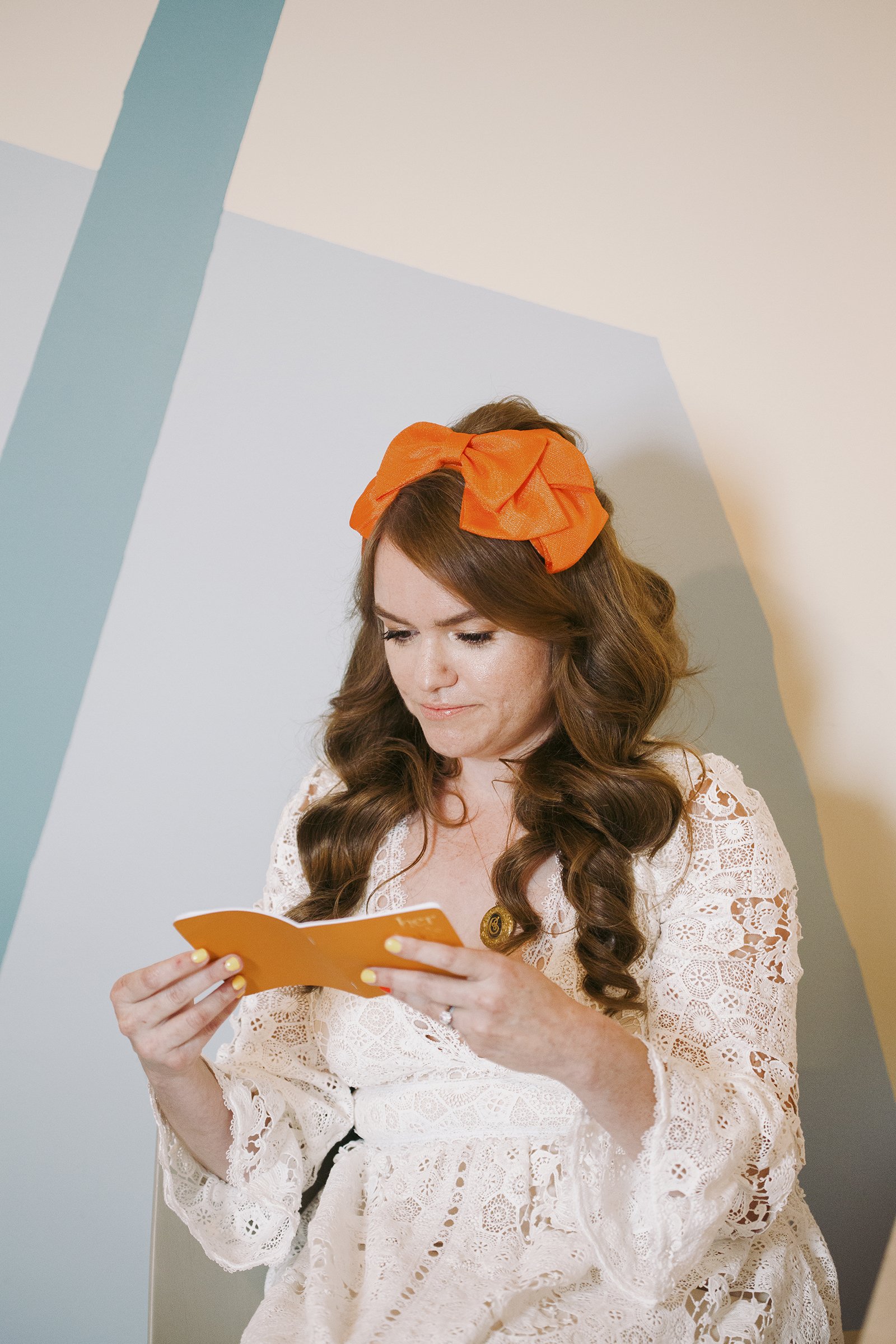 bride went with a 60's and 70's half up hairstyle with volume and vintage bridal accessories