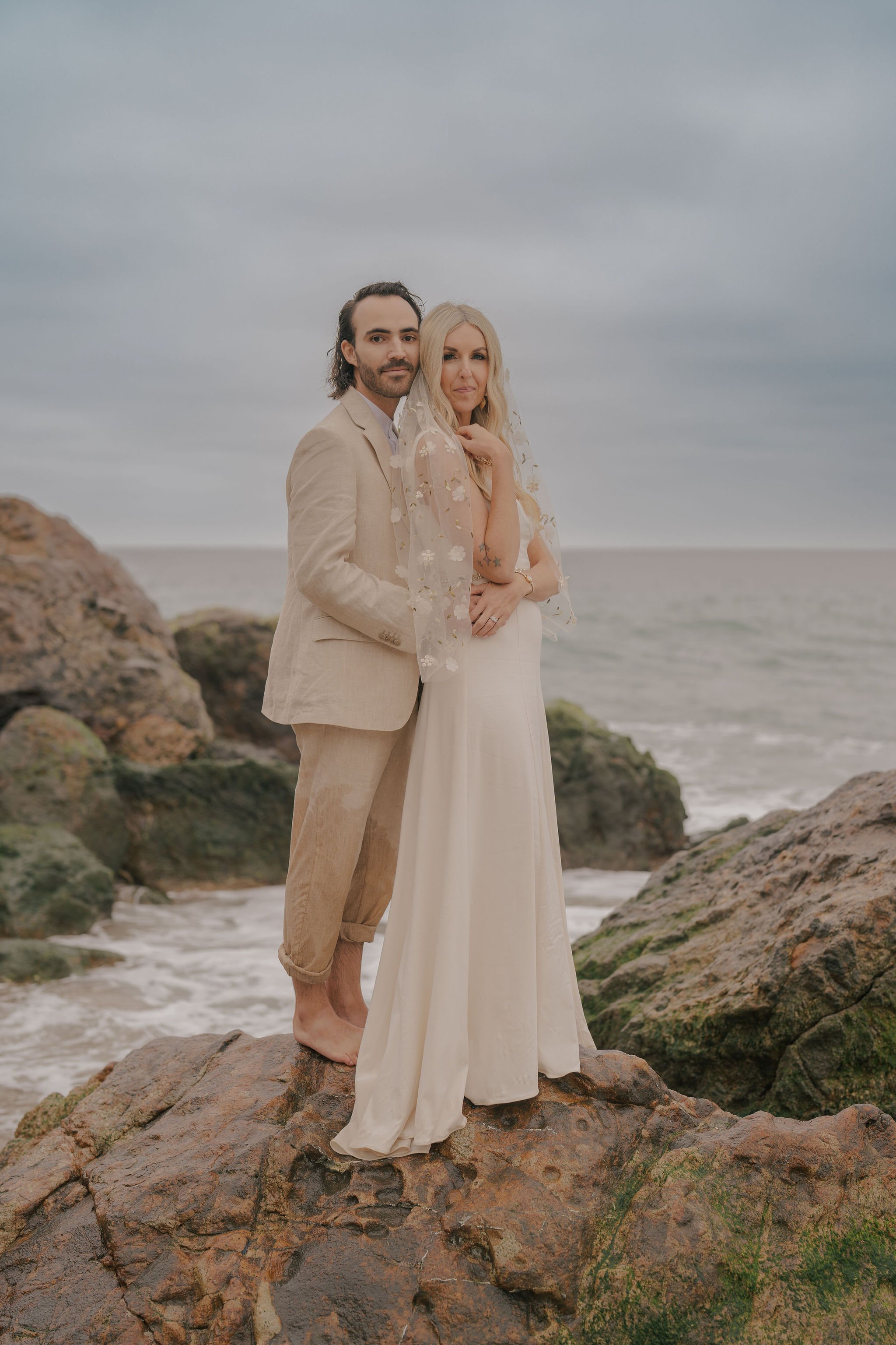 founder, podcast host, and manifestation coach plans wedding along the cliffs of point dume beach in malibu