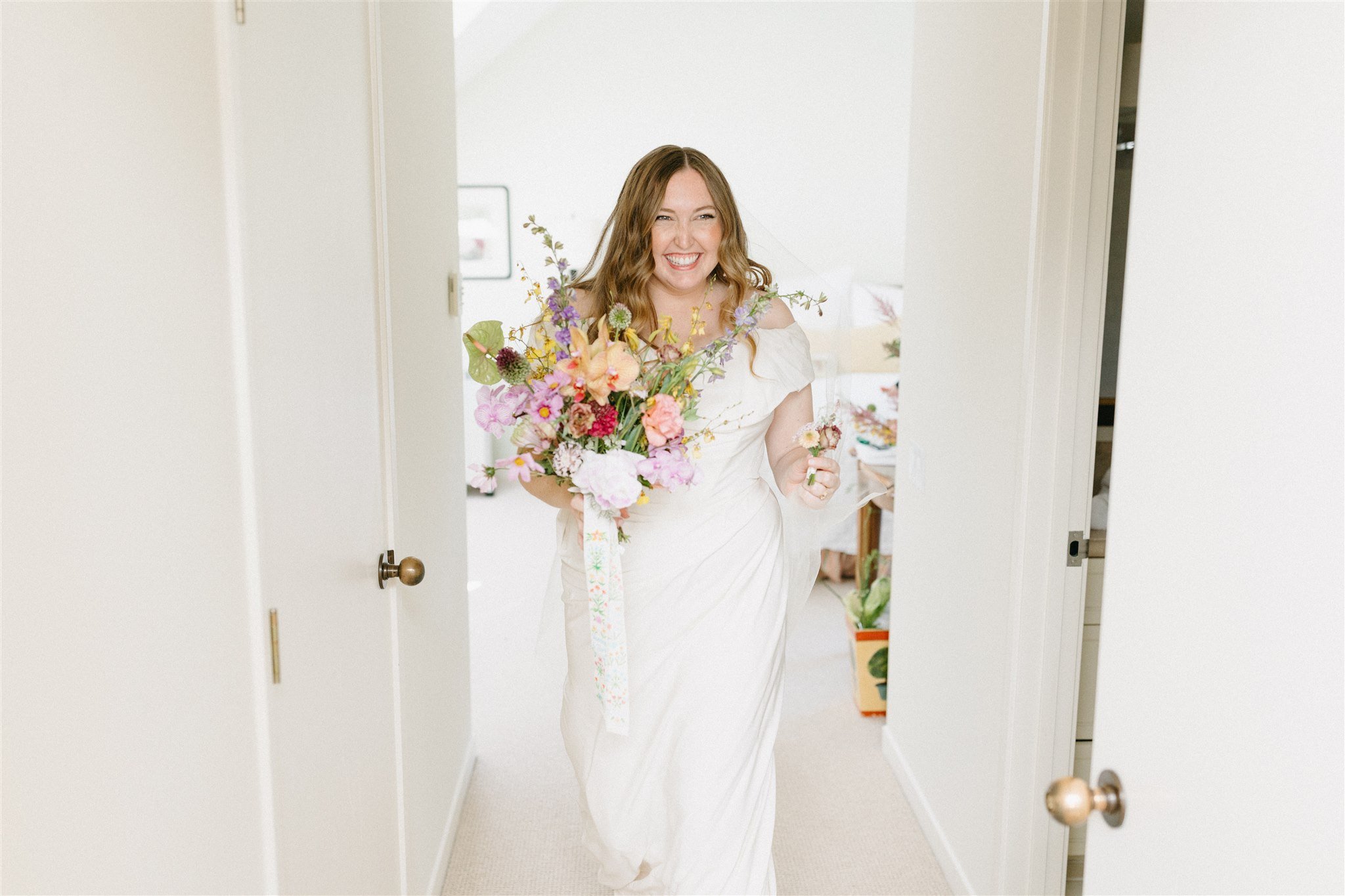 bride and her DIY bouquet of wildflowers