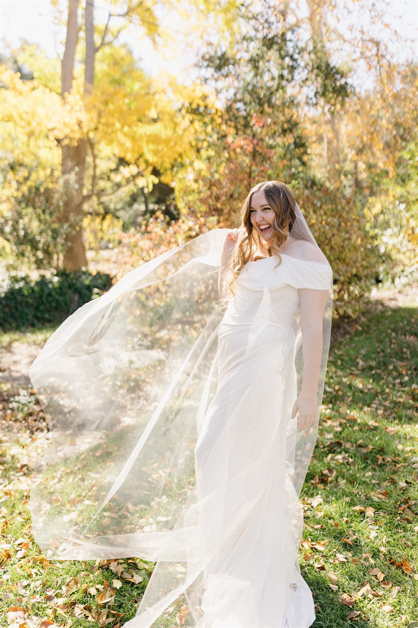 bride's veil flowing in the wind during epic first look at descanso gardens