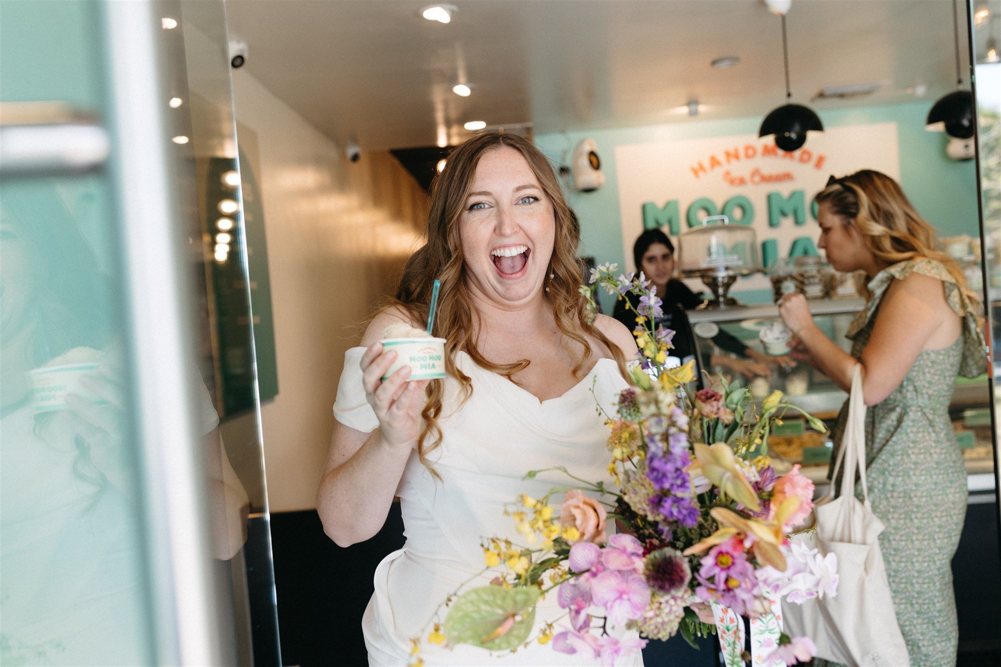 bride and groom go to ice cream shop on their wedding day