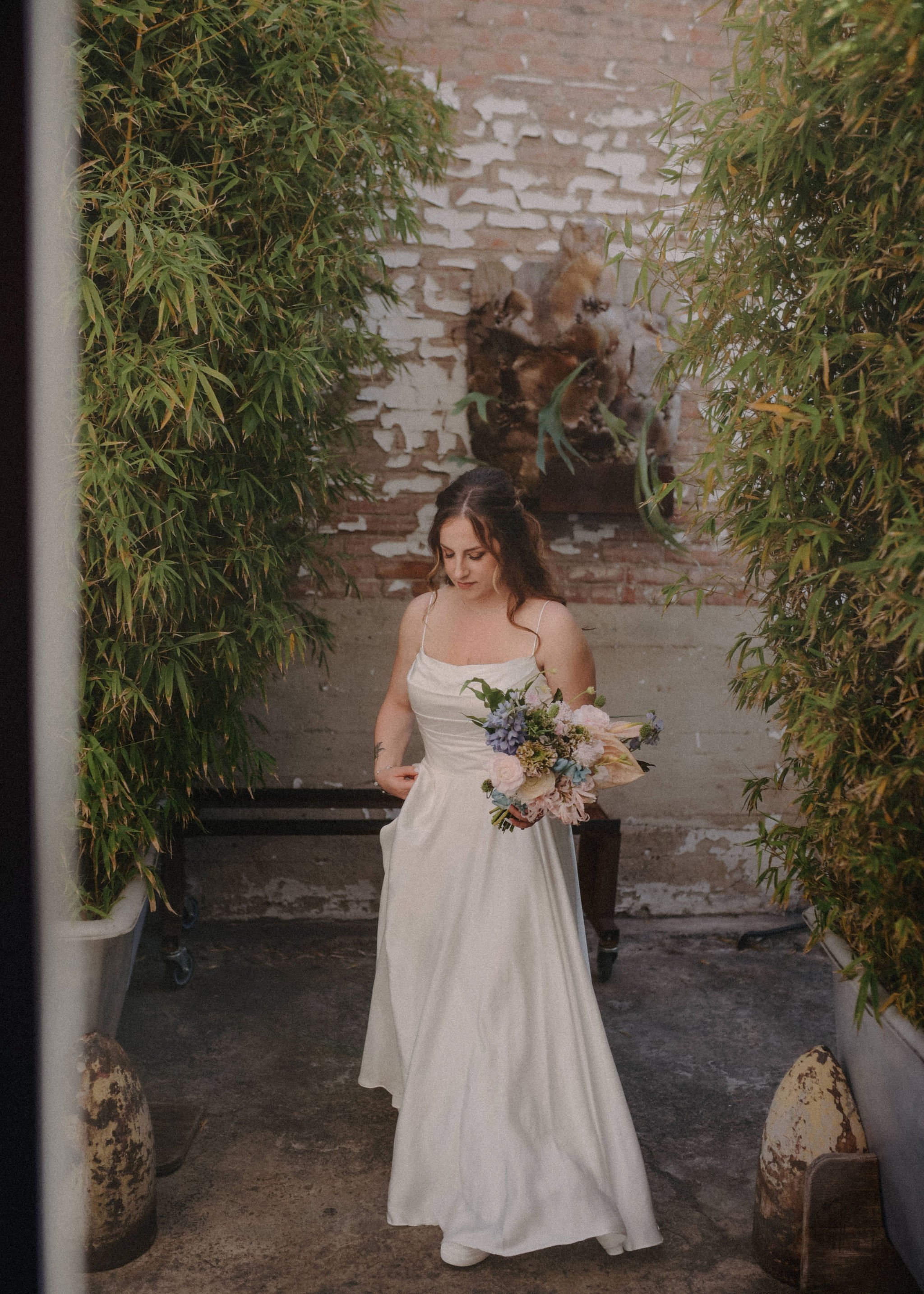 bride goes with gorgeous braided hairstyle and natural makeup for her DTLA wedding
