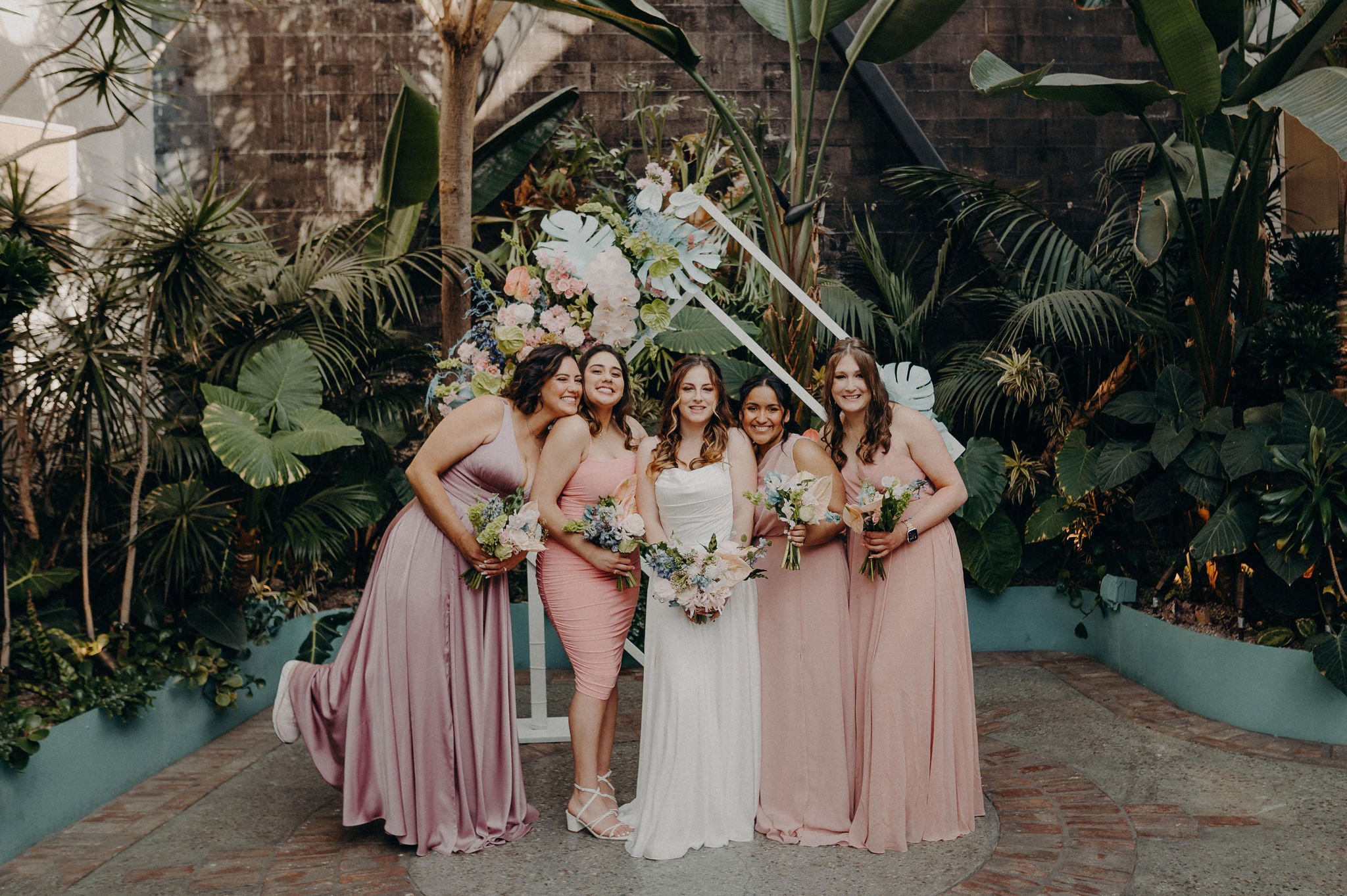 bride and bridesmaids in blush/pink dresses before the wedding in downtown la