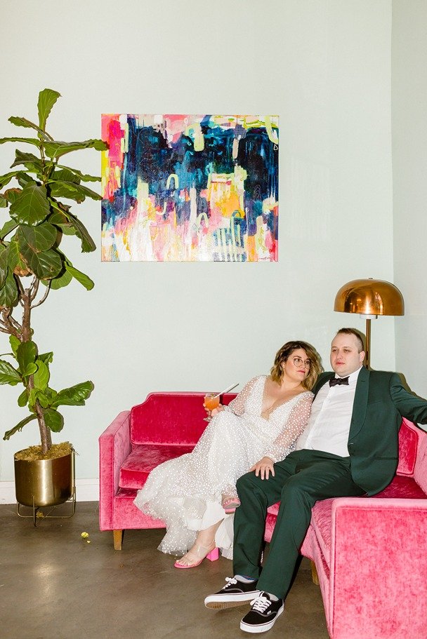 flash photos with the bride and groom on their pink sofa at funky venue, the fig house, in highland park