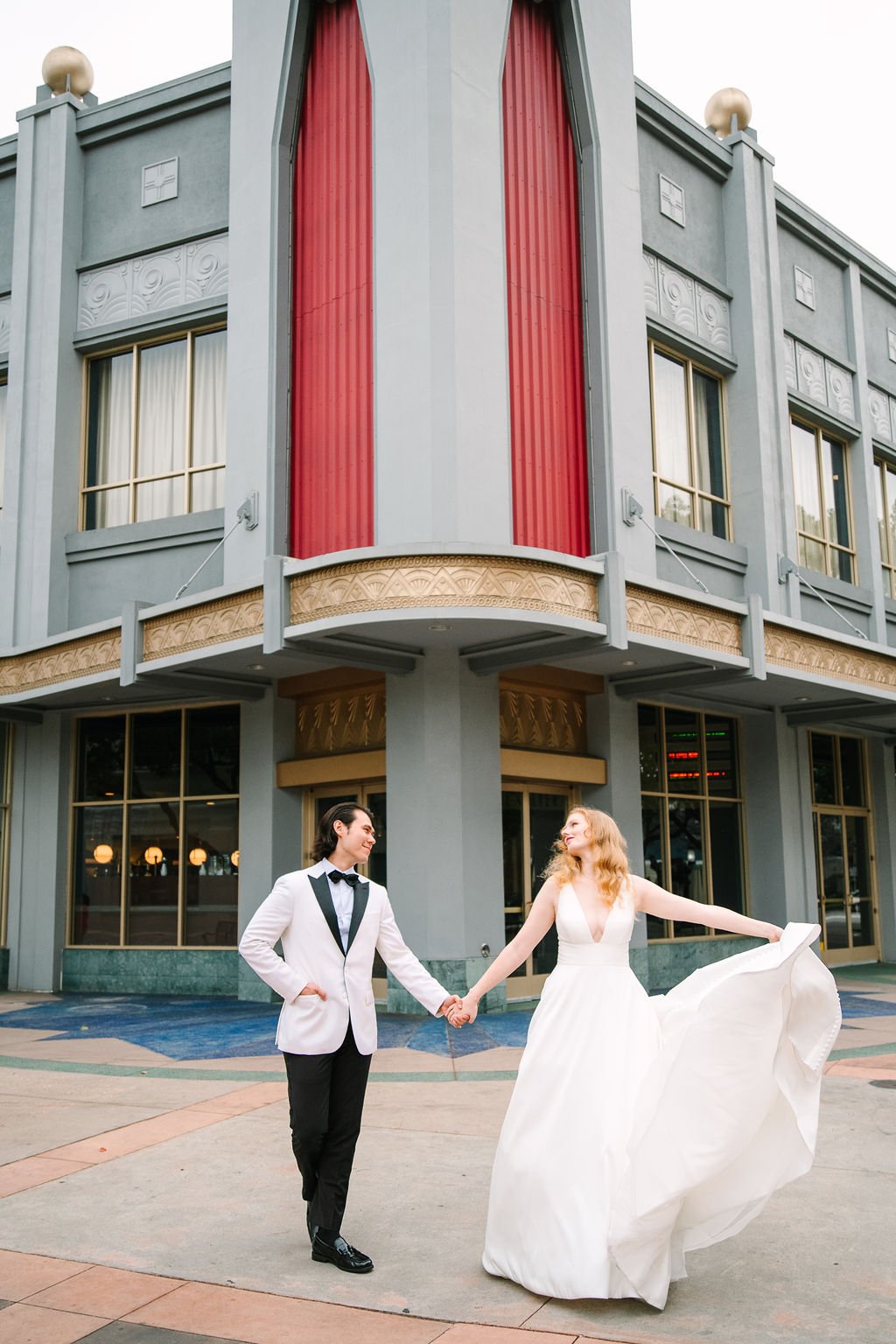 bride and groom take wedding day photos all around downtown culver city