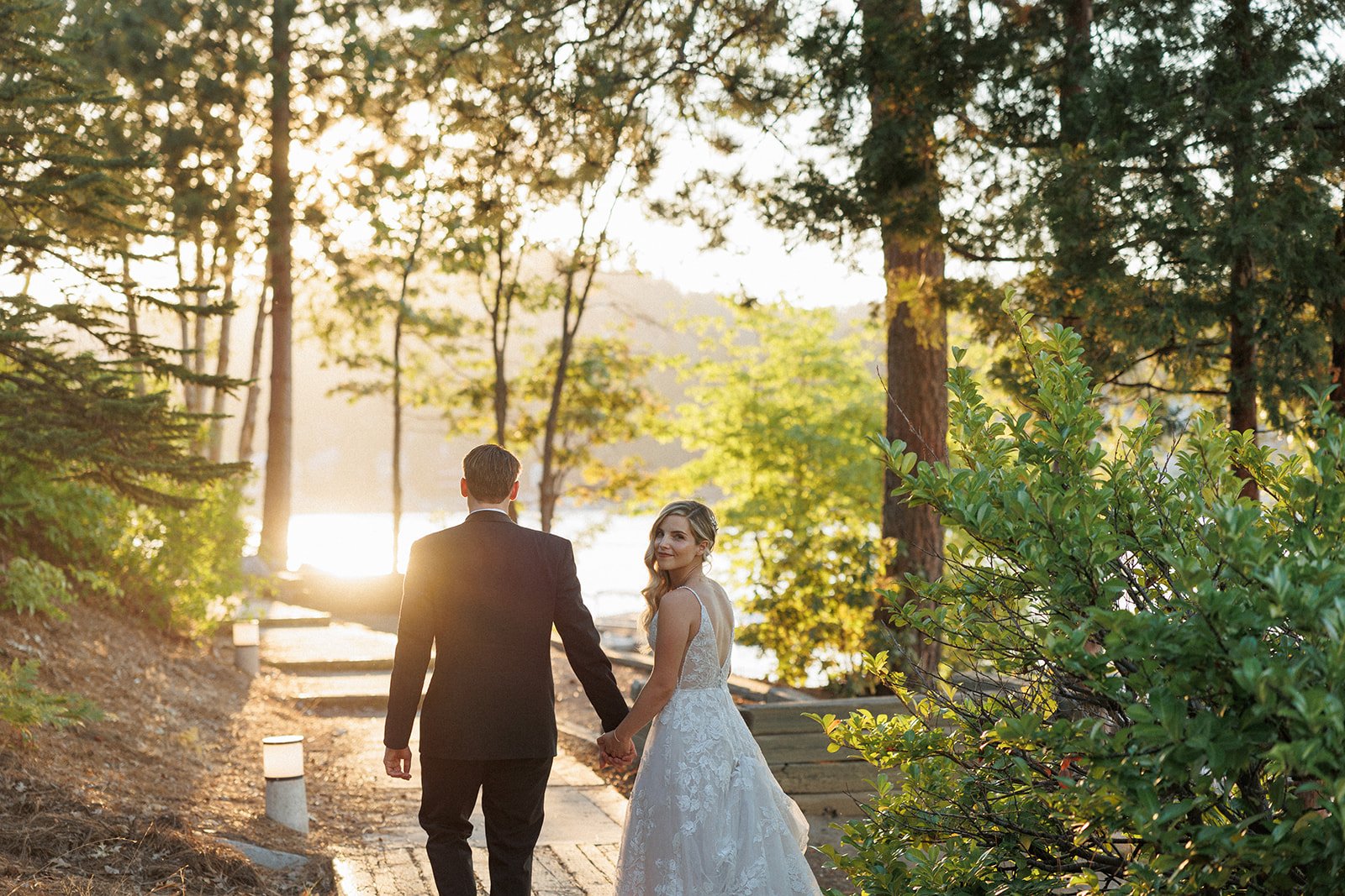 bride and groom enjoy the sunset on gorgeous lake arrowhead, CA