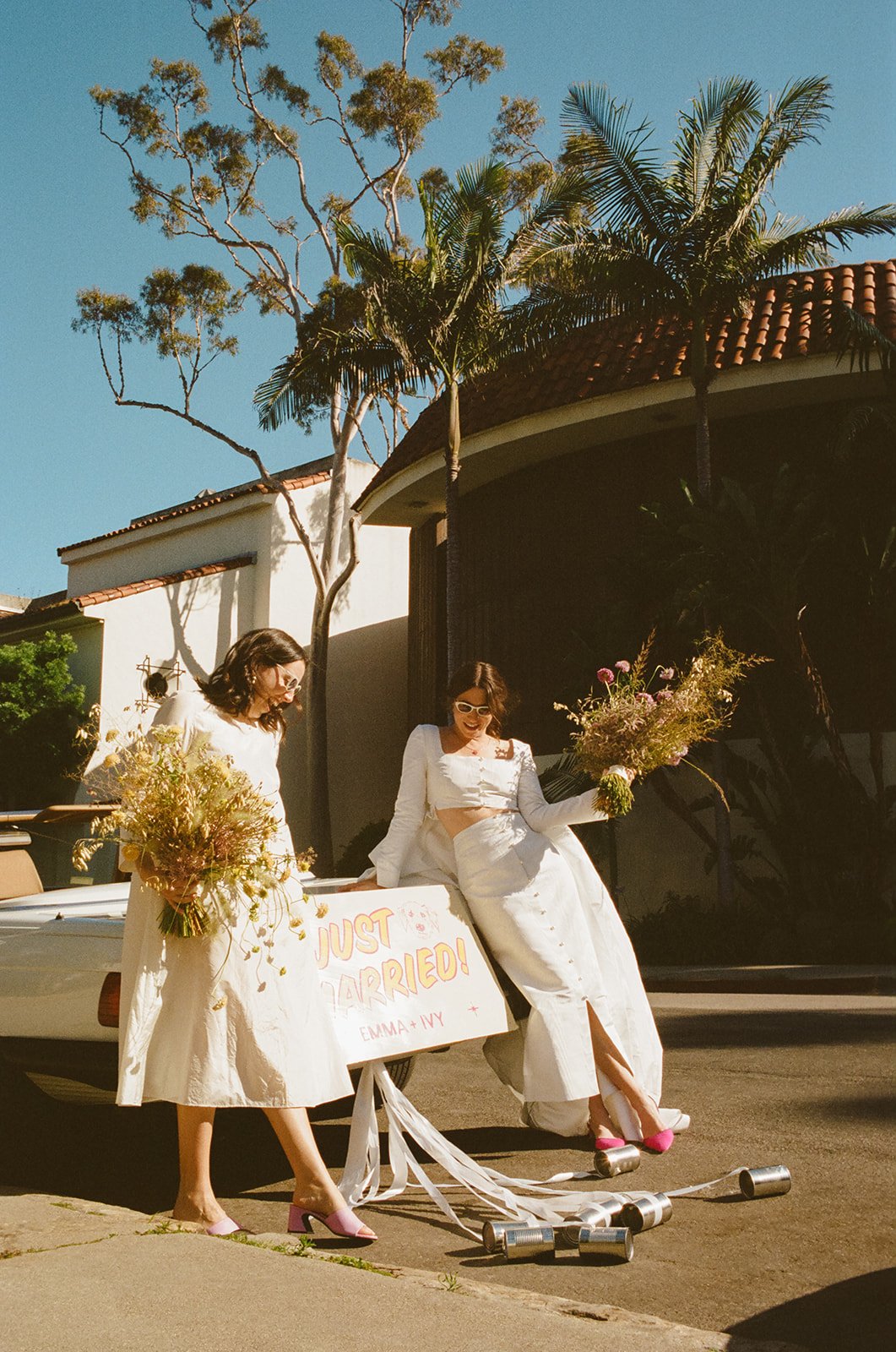 southern california brides iconic wedding day driving off in their vintage convertible