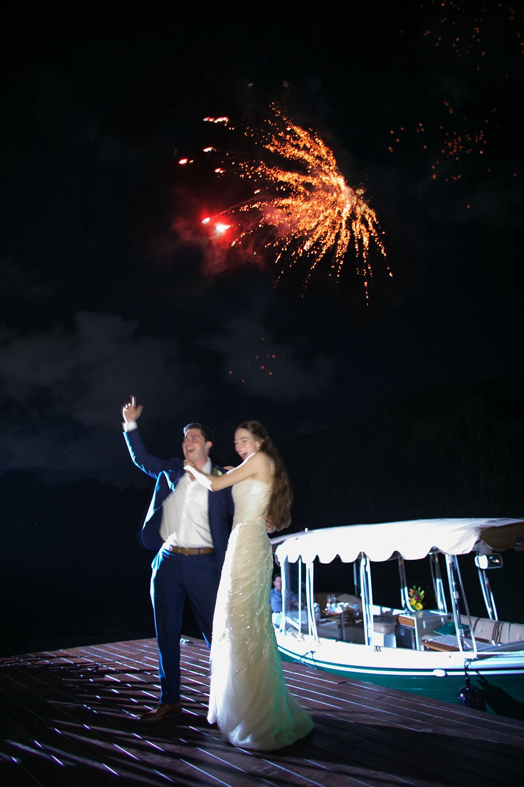 bride and groom enter the wedding reception with fireworks at banyan tree mayakoba in riviera maya mexico