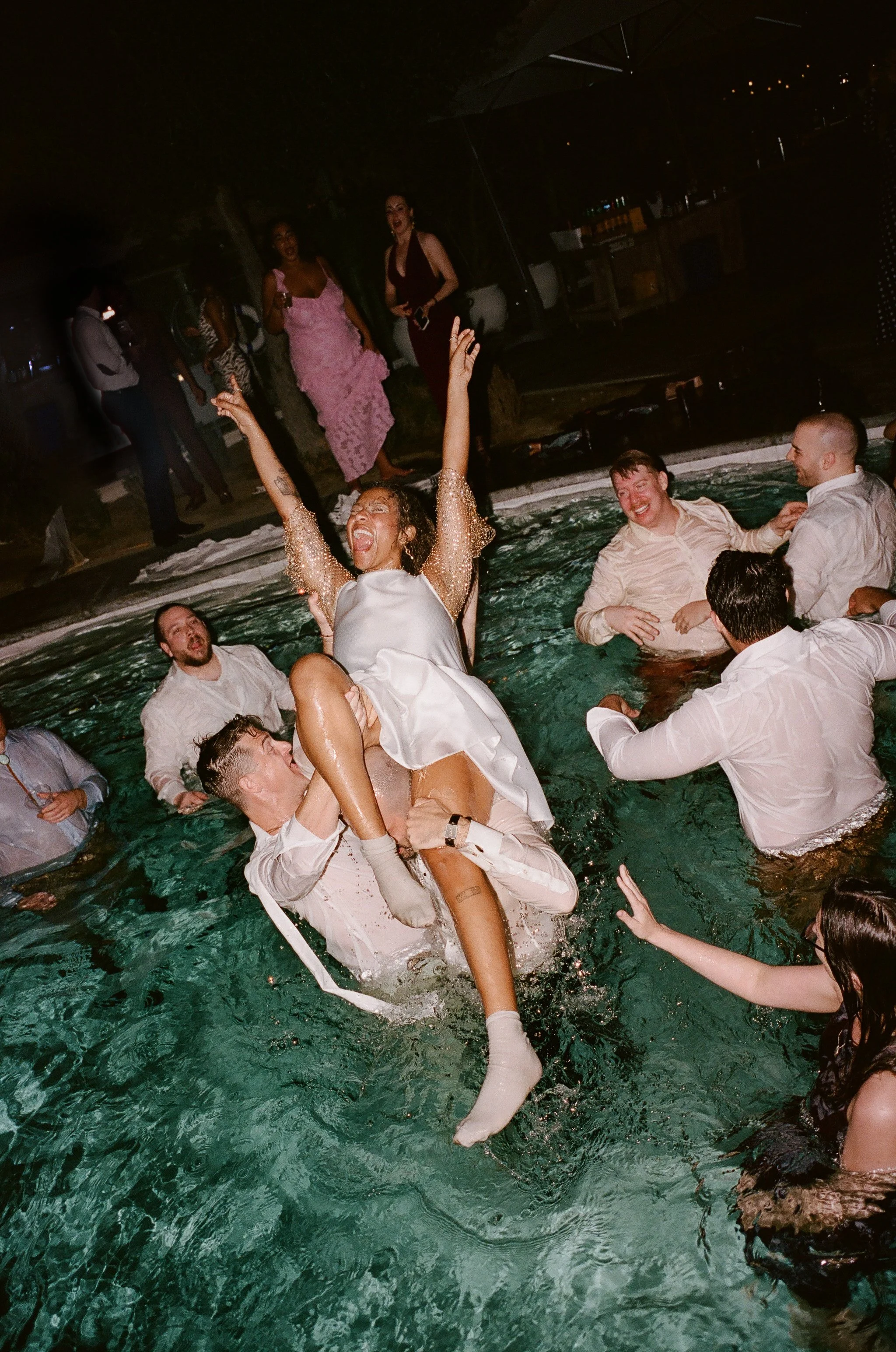 palm springs wedding where all the guests jump in the pool at the reception