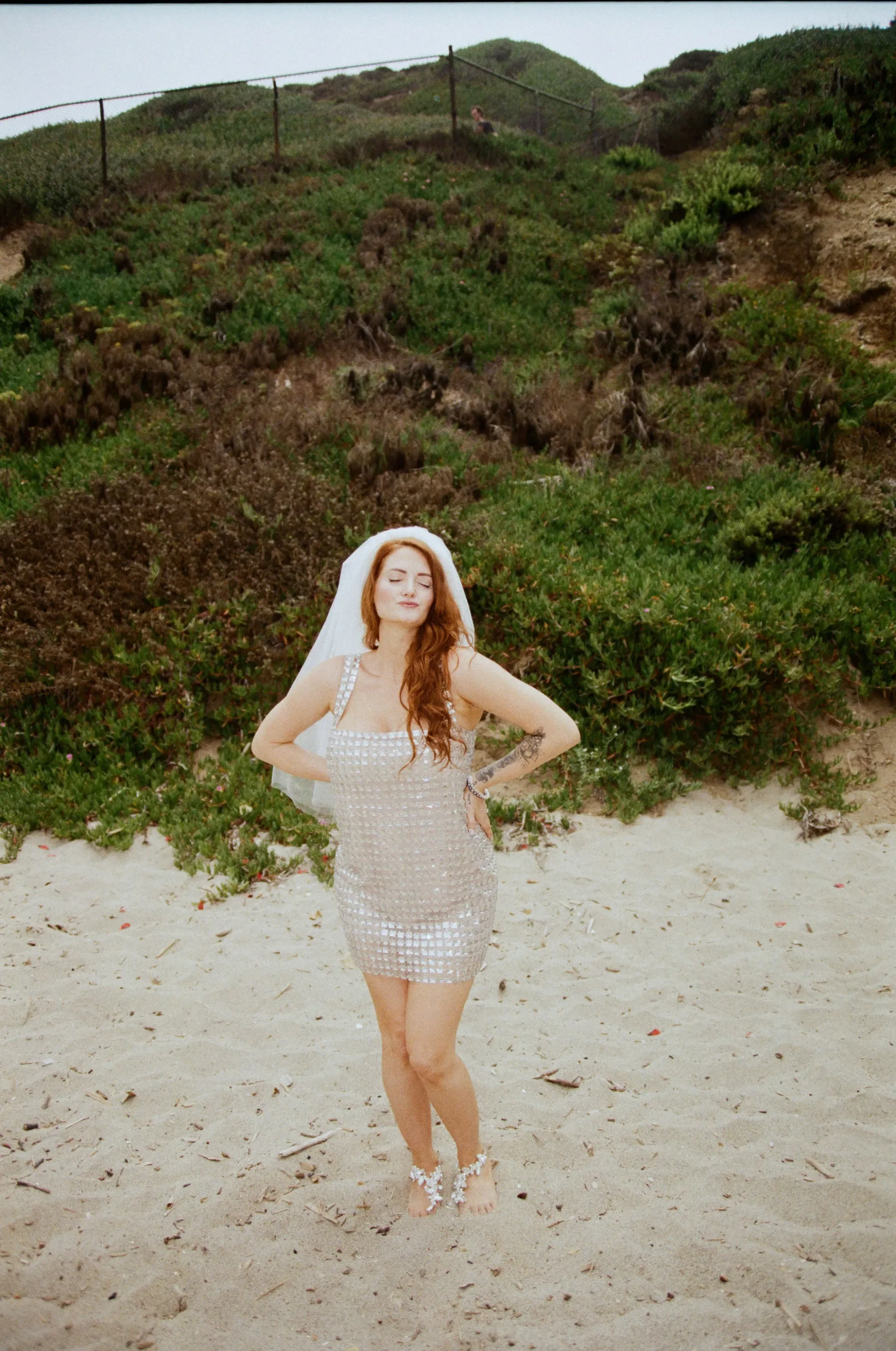 malibu bride wears sequined wedding dress on the beach