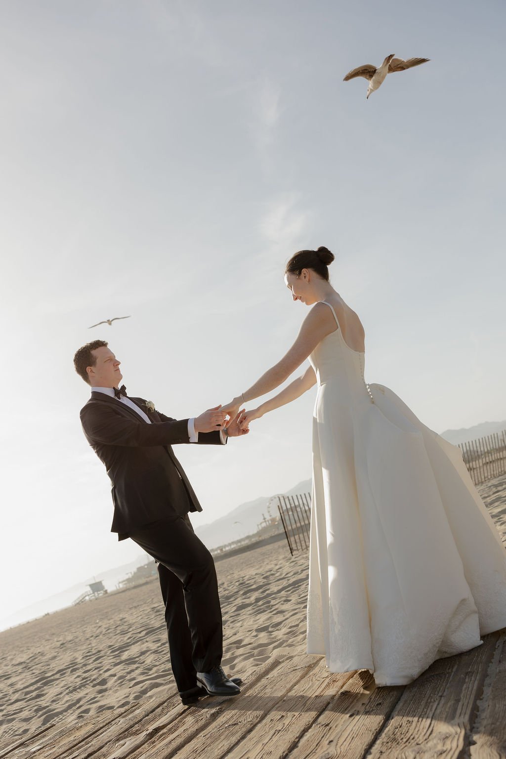 bride and groom planned their dream destination wedding in santa monica, california at the iconic Shutters on the beach