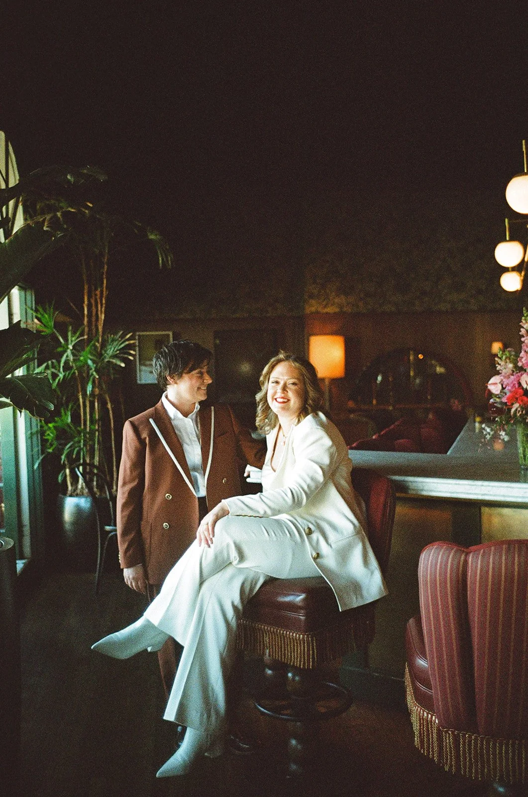 same sex wedding in downtown los angeles, featuring two brides wearing iconic womens suits