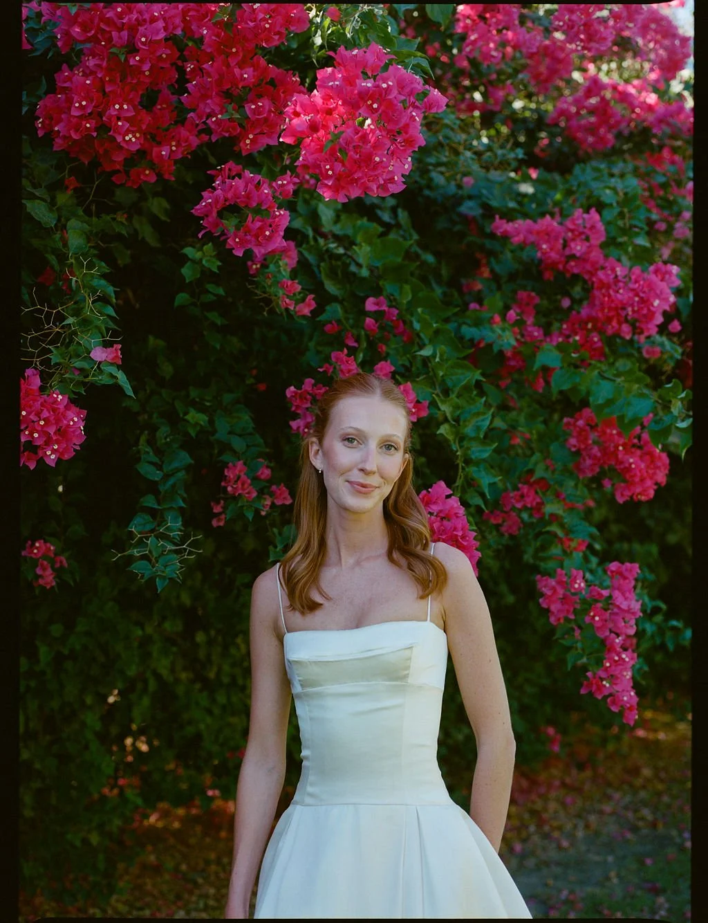 bride in montecito surrounded by flowers